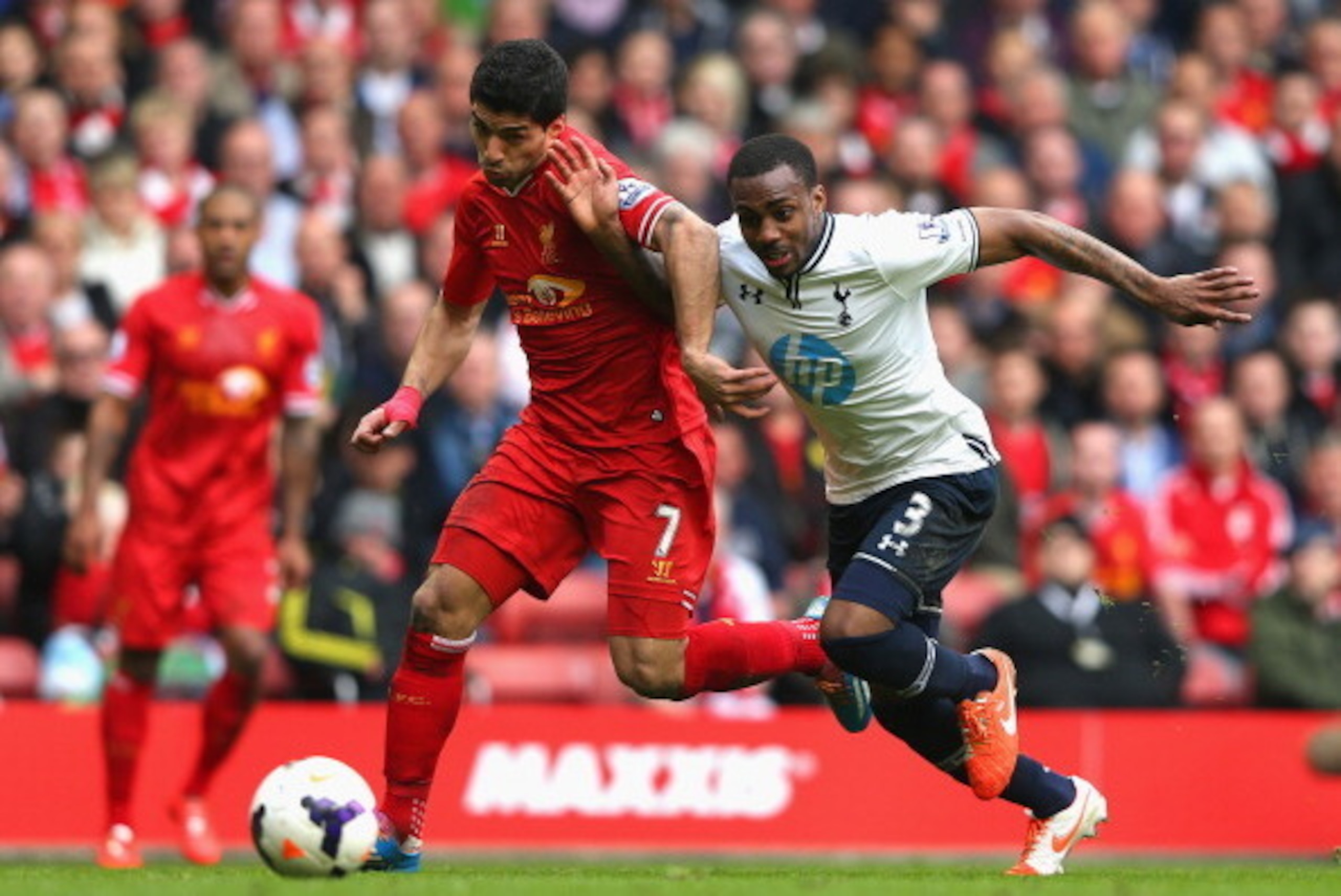LIVERPOOL, ENGLAND - MARCH 30:  Luis Suarez of Liverpool competes with Danny Rose of Tottenham Hotspur during the Barclays Premier League match between Liverpool and Tottenham Hotspur at Anfield on March 30, 2014 in Liverpool, England.  (Photo by Alex Liv