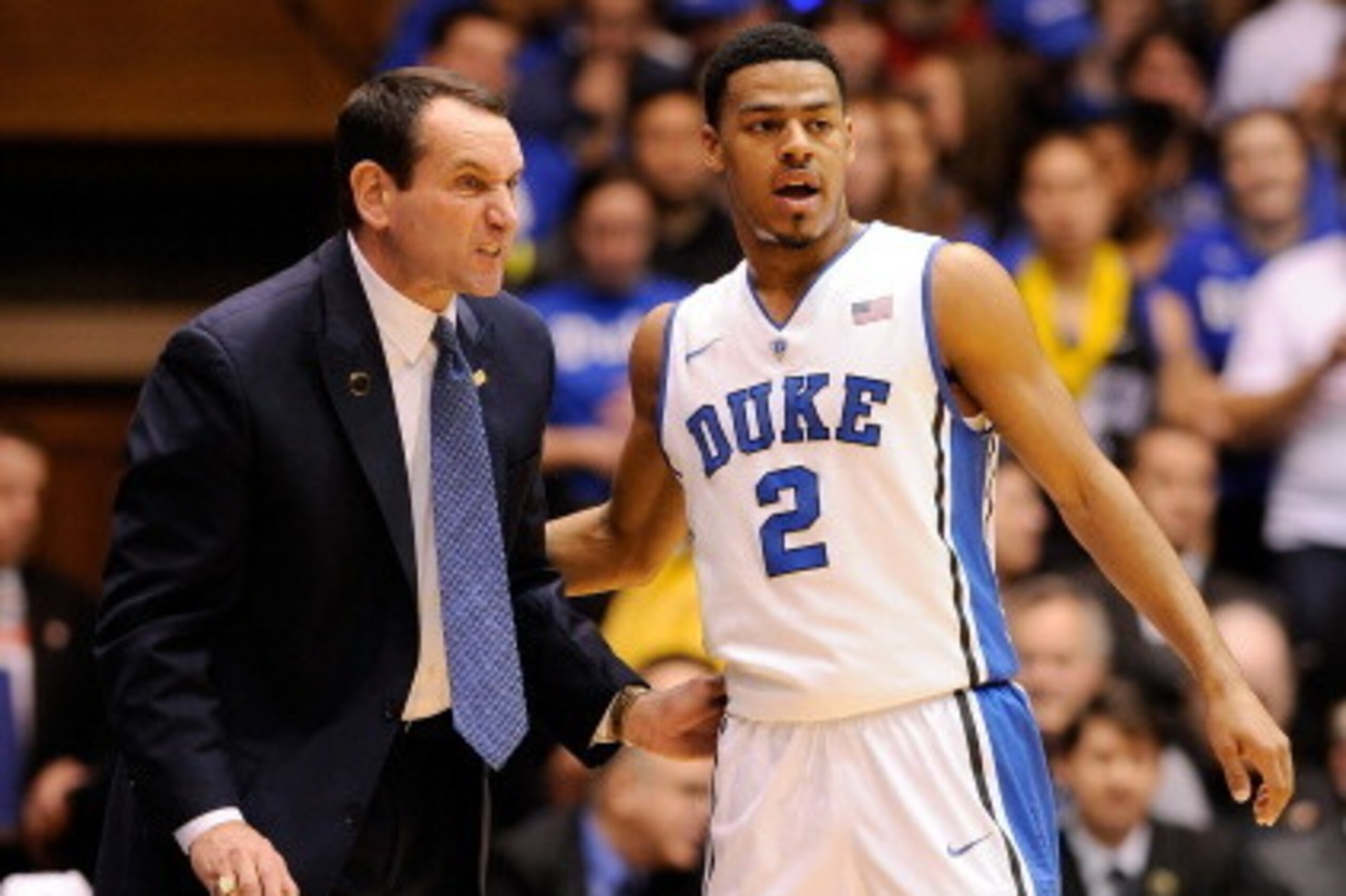 DURHAM, NC - JANUARY 18:  Coach Mike Krzyzewski confers with Quinn Cook #2 of the Duke Blue Devils during their game against the North Carolina State Wolfpack at Cameron Indoor Stadium on January 18, 2014 in Durham, North Carolina.  (Photo by Grant Halver