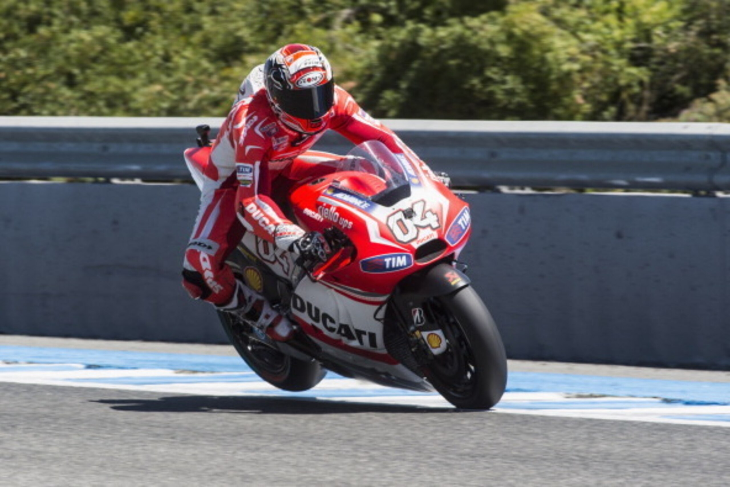 JEREZ DE LA FRONTERA, SPAIN - MAY 03:   Andrea Dovizioso of Italy and Ducati Team  lifts the rear wheel during the MotoGp of Spain - Qualifying at Circuito de Jerez on May 3, 2014 in Jerez de la Frontera, Spain.  (Photo by Mirco Lazzari gp/Getty Images)