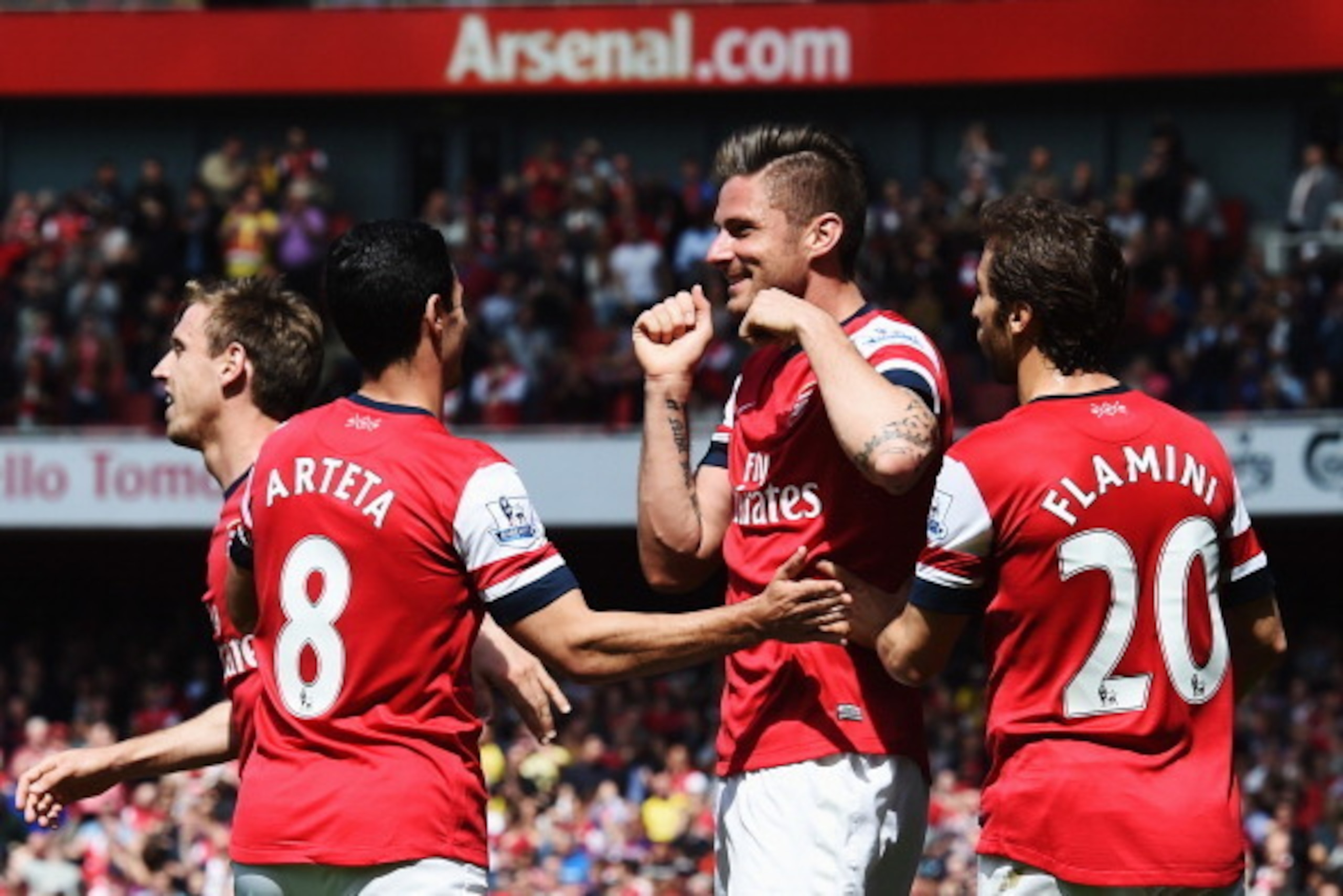 LONDON, ENGLAND - MAY 04:  Olivier Giroud (C) of Arsenal celebrates with team mates after scoring during the Barclays Premier League match between Arsenal and West Bromwich Albion at the Emirates Stadium on May 4, 2014 in London, England.  (Photo by Shaun