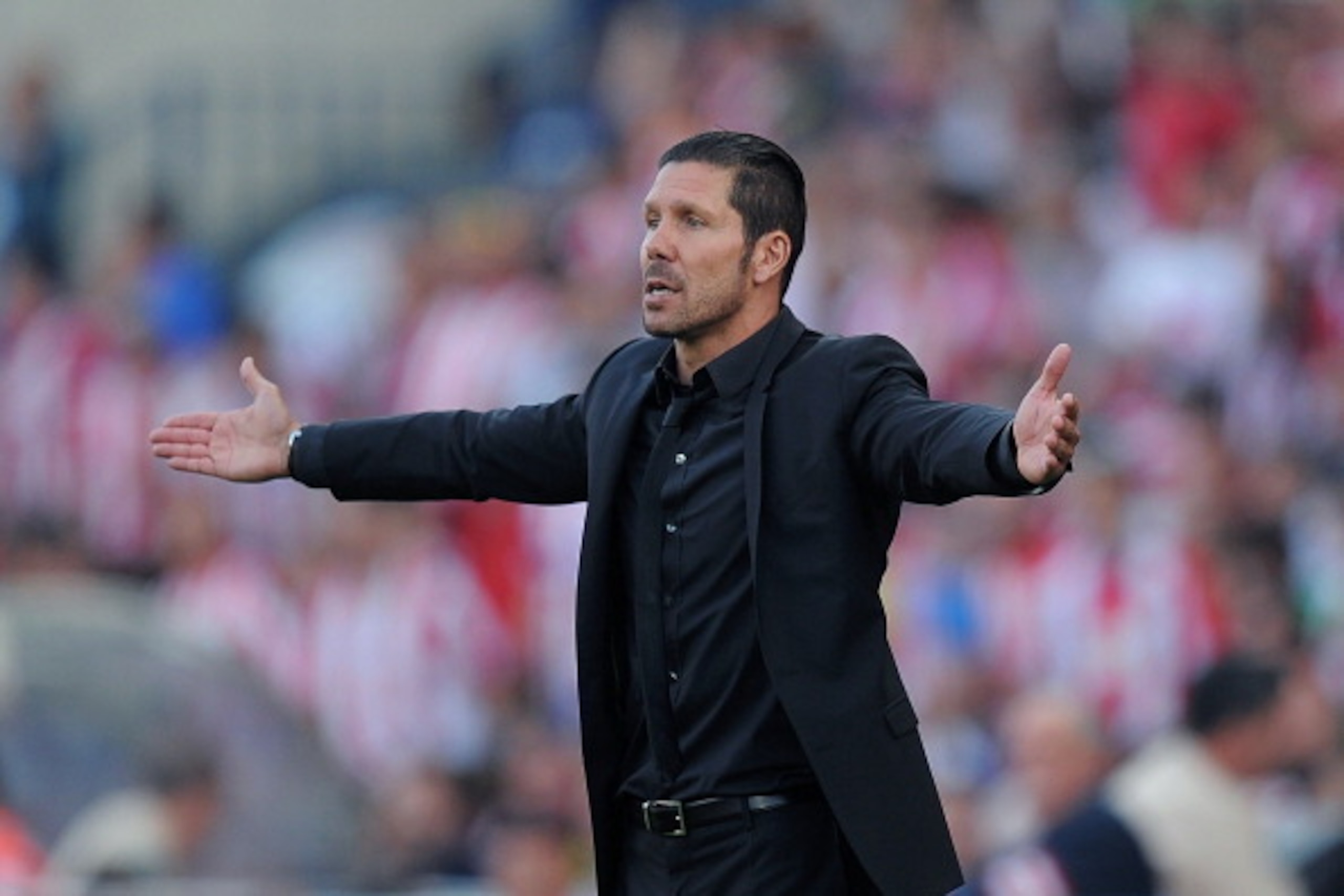 MADRID, SPAIN - MAY 11:  Head coach Diego Simeone of Club Atletico de Madrid reacts during the La Liga match between Club Atletico de Madrid and Malaga CF at Vicente Calderon Stadium on May 11, 2014 in Madrid, Spain.  (Photo by Denis Doyle/Getty Images)