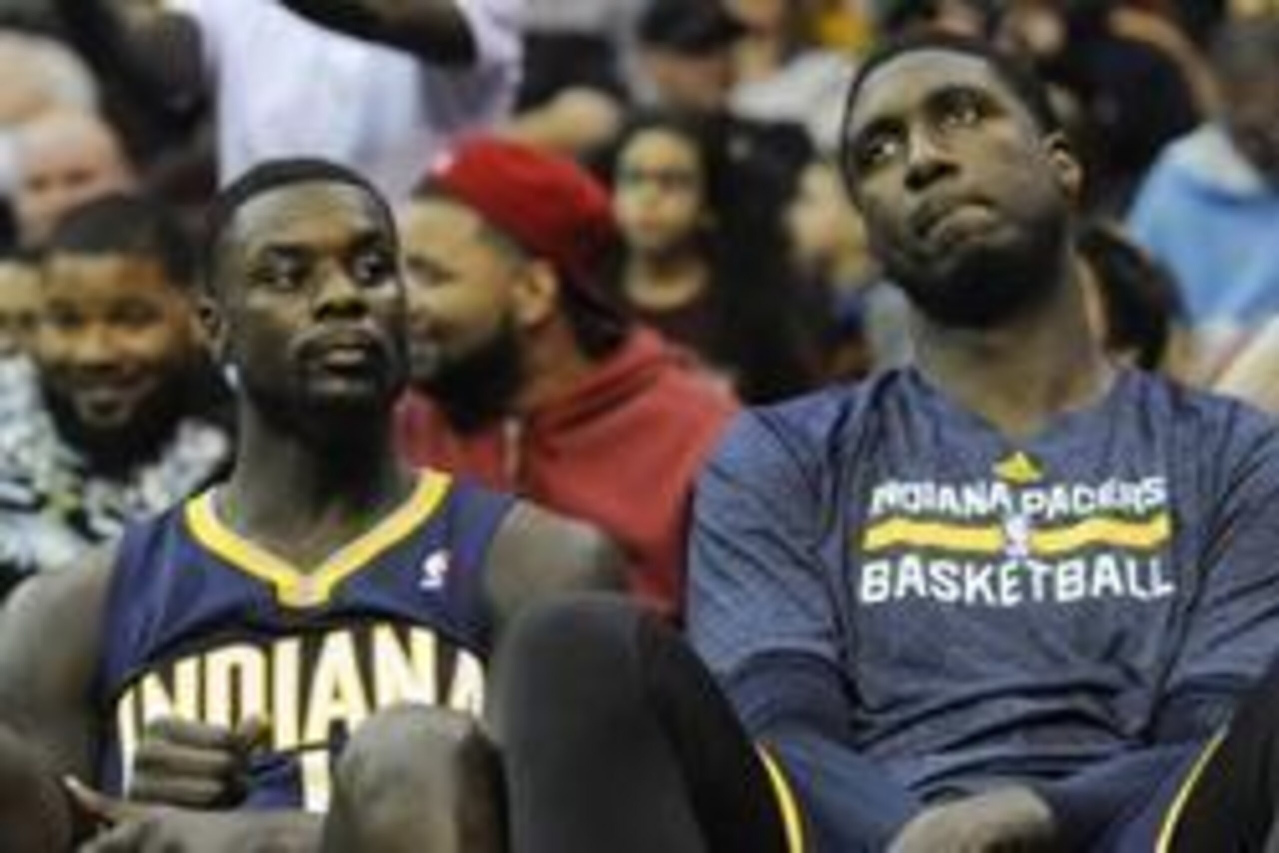 Mar 30, 2014; Cleveland, OH, USA; Indiana Pacers guard Lance Stephenson (left) and center Roy Hibbert (55) react on the bench in the fourth quarter against the Cleveland Cavaliers at Quicken Loans Arena. Mandatory Credit: David Richard-USA TODAY Sports