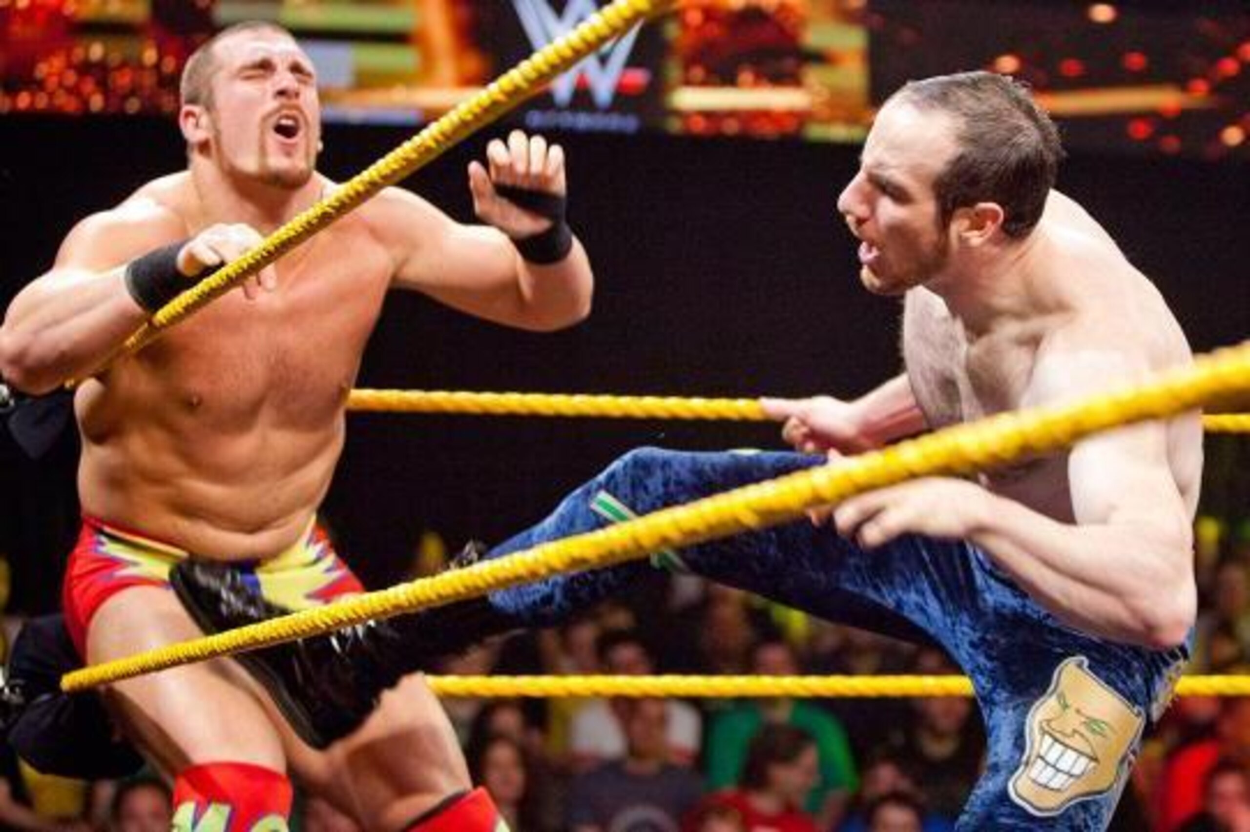 Aiden English keeps Mojo Rawley in the corner.