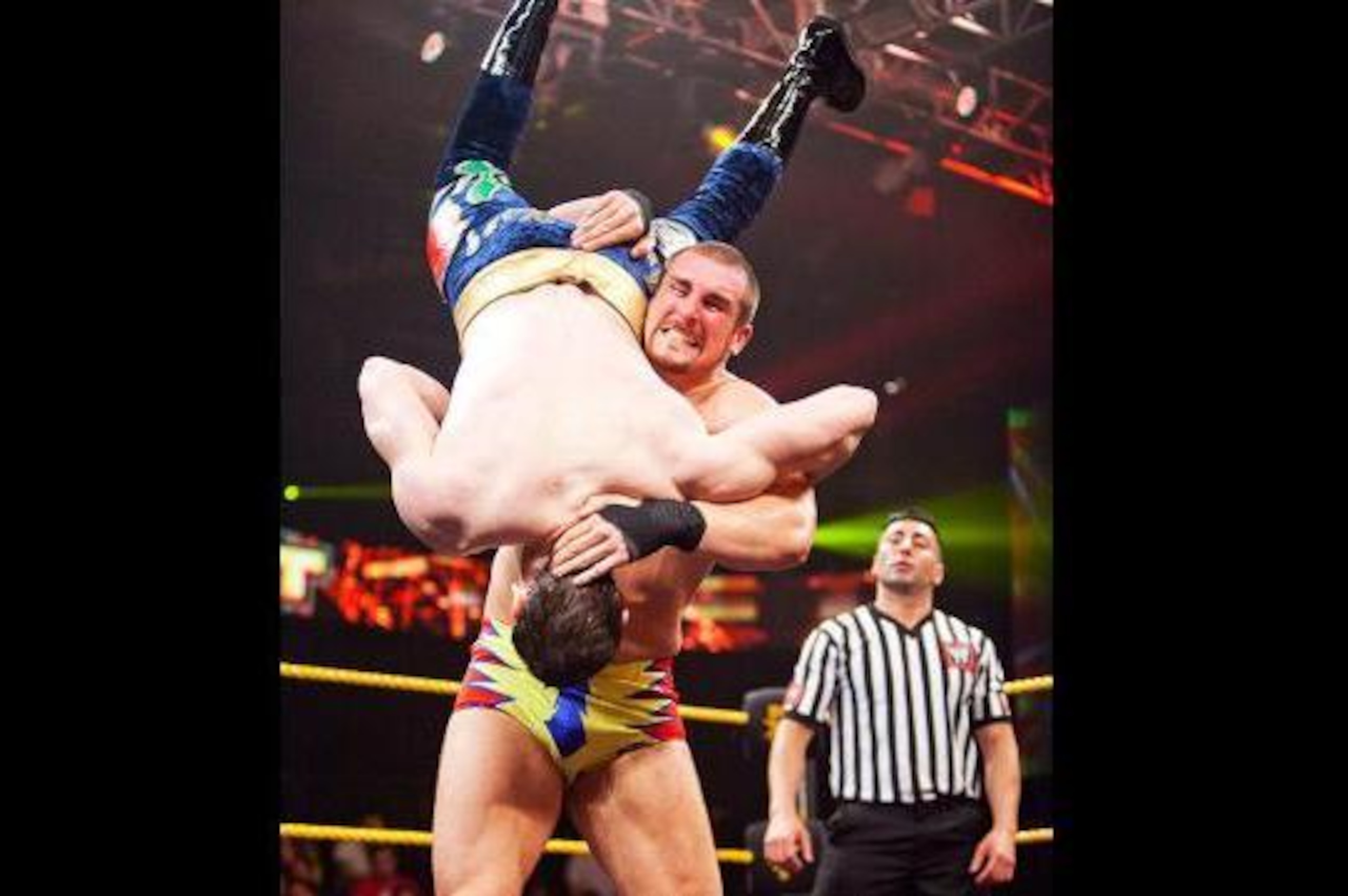 Mojo Rawley scoops up Aiden English.