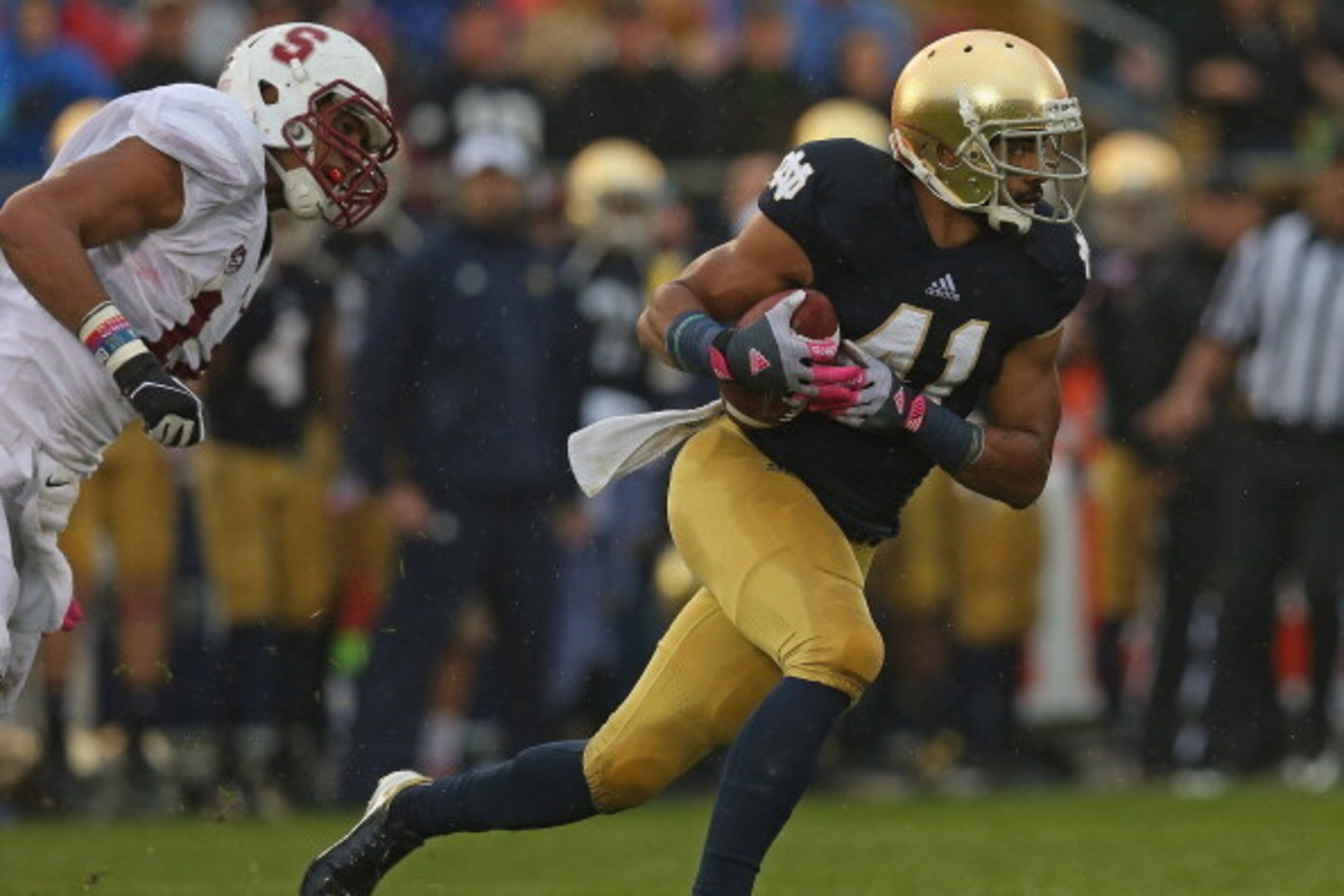 SOUTH BEND, IN - OCTOBER 13: Matthias Farley #41 of the Notre Dame Fighting Irish breaks away from Levine Toilolo#11 of the Standford Cardinal after intercepting a pass at Notre Dame Stadium on October 13, 2012 in South Bend, Indiana. Notre Dame defeated SOUTH BEND, IN - OCTOBER 13: Matthias Farley #41 of the Notre Dame Fighting Irish breaks away from Levine Toilolo#11 of the Standford Cardinal after intercepting a pass at Notre Dame Stadium on October 13, 2012 in South Bend, Indiana. Notre Dame defeated