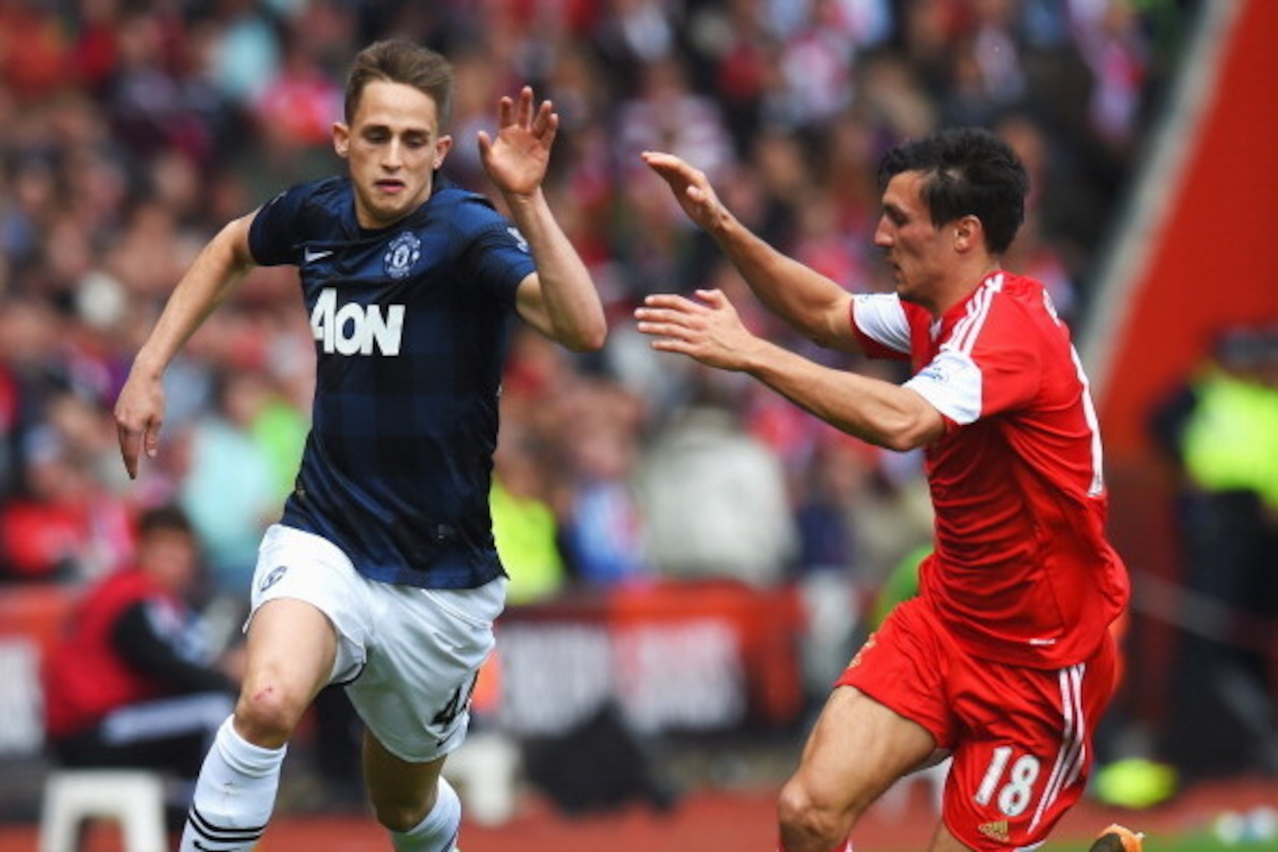 SOUTHAMPTON, ENGLAND - MAY 11:  (L-R) Adnan Januzaj of Manchester United is challenged by Jack Cork of Southampton during the Barclays Premier League match between Southampton and Manchester United at St Mary's Stadium on May 11, 2014 in Southampton, Engl