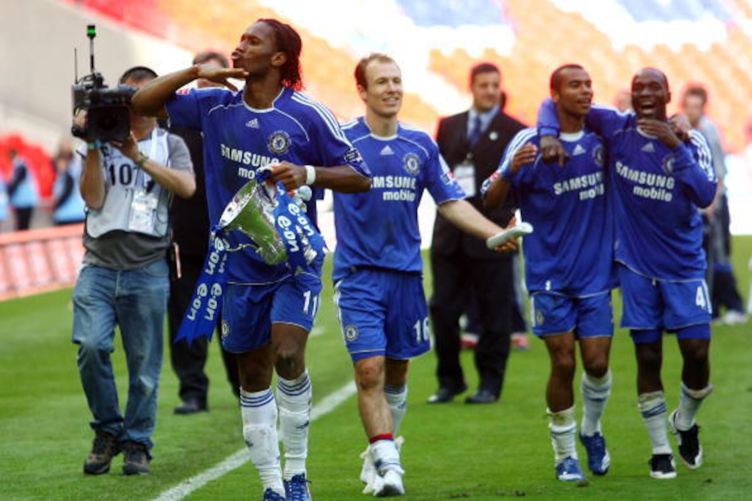 LONDON - MAY 19:  Didier Drogba of Chelsea celebrates with the trophy following the FA Cup Final match sponsored by E.ON between Manchester United and Chelsea at Wembley Stadium on May 19, 2007 in London, England.  (Photo by Shaun Botterill/Getty Images)