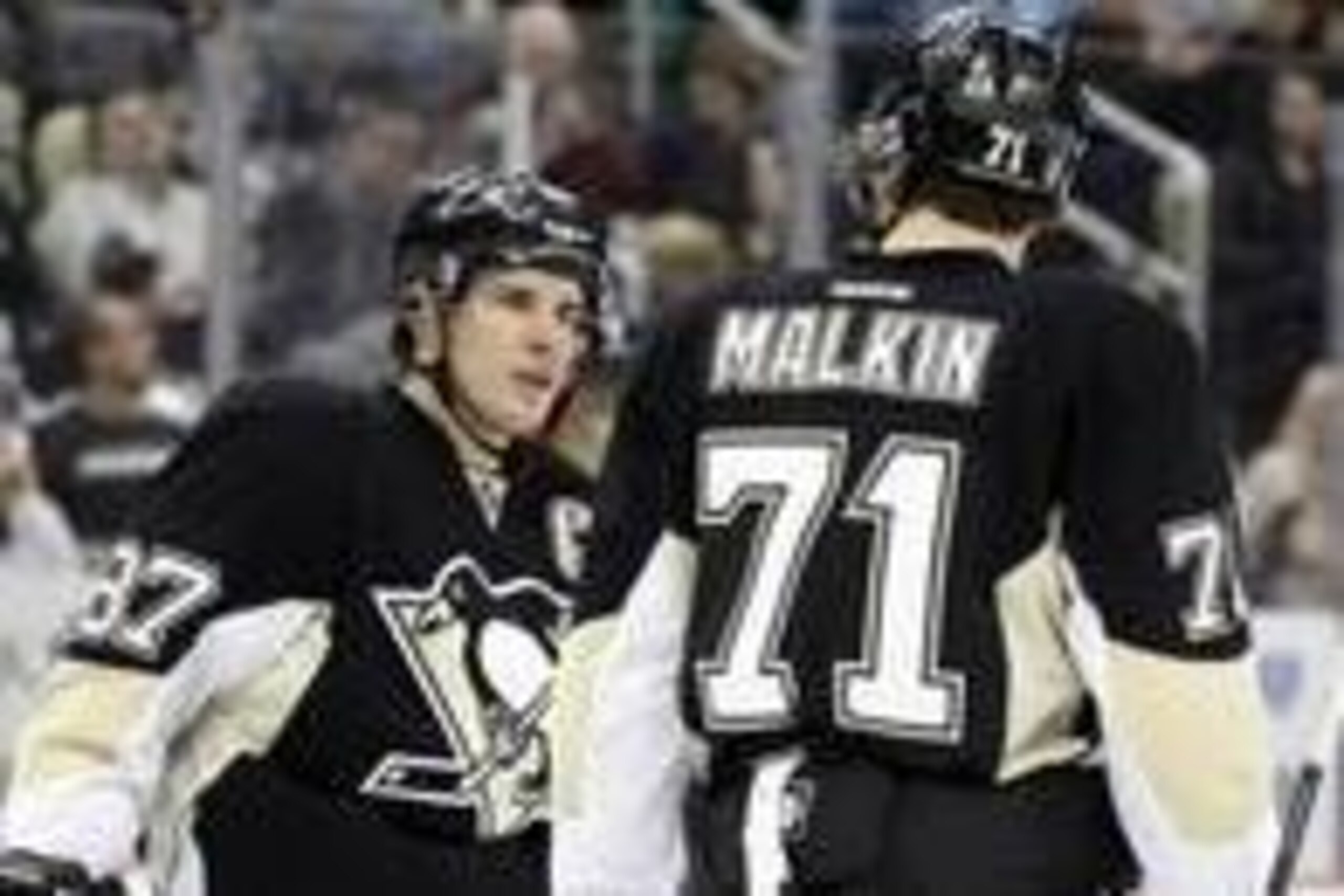 Feb 7, 2014; Pittsburgh, PA, USA;  Pittsburgh Penguins center Sidney Crosby (87) talks to center Evgeni Malkin (71) during a time-out against the New York Rangers in the second period at the CONSOL Energy Center. The Rangers won 4-3 in a shootout. Mandato