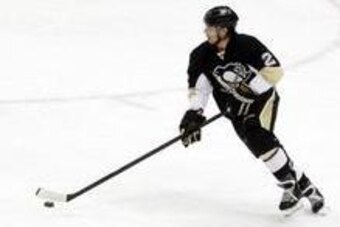 Apr 1, 2014; Pittsburgh, PA, USA; Pittsburgh Penguins defenseman Matt Niskanen (2) skates with the puck against the Carolina Hurricanes during the second period at the CONSOL Energy Center. Carolina won 4-1. Mandatory Credit: Charles LeClaire-USA TODAY Sp