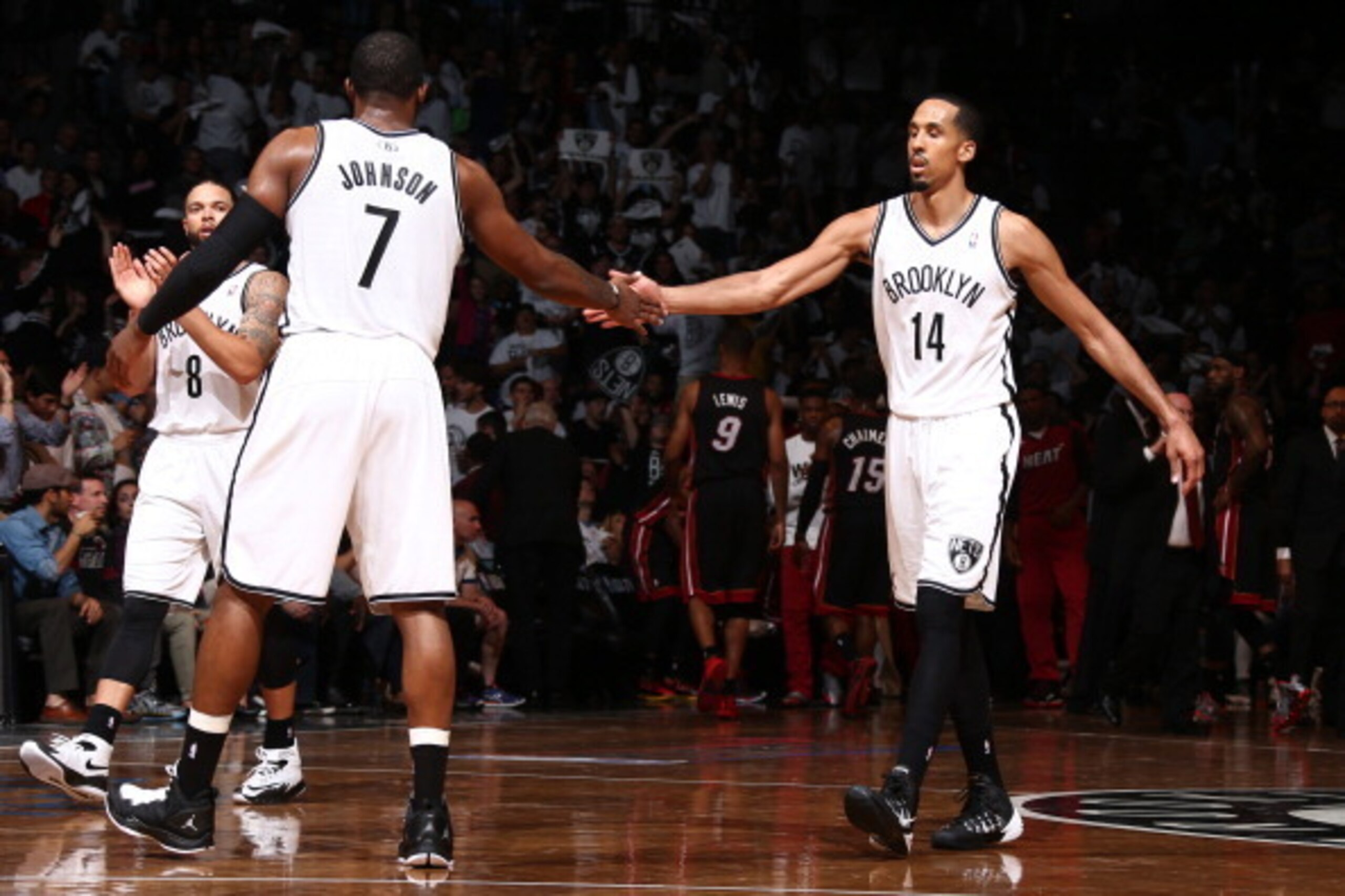 BROOKLYN, NY - MAY 10: Shaun Livingston #14 and Joe Johnson #7 of the Brooklyn Nets slap hands during a game against the Miami Heat during Game Three of the Eastern Conference Semifinals on May 10, 2014 at Barclays Center in Brooklyn. NOTE TO USER: User e