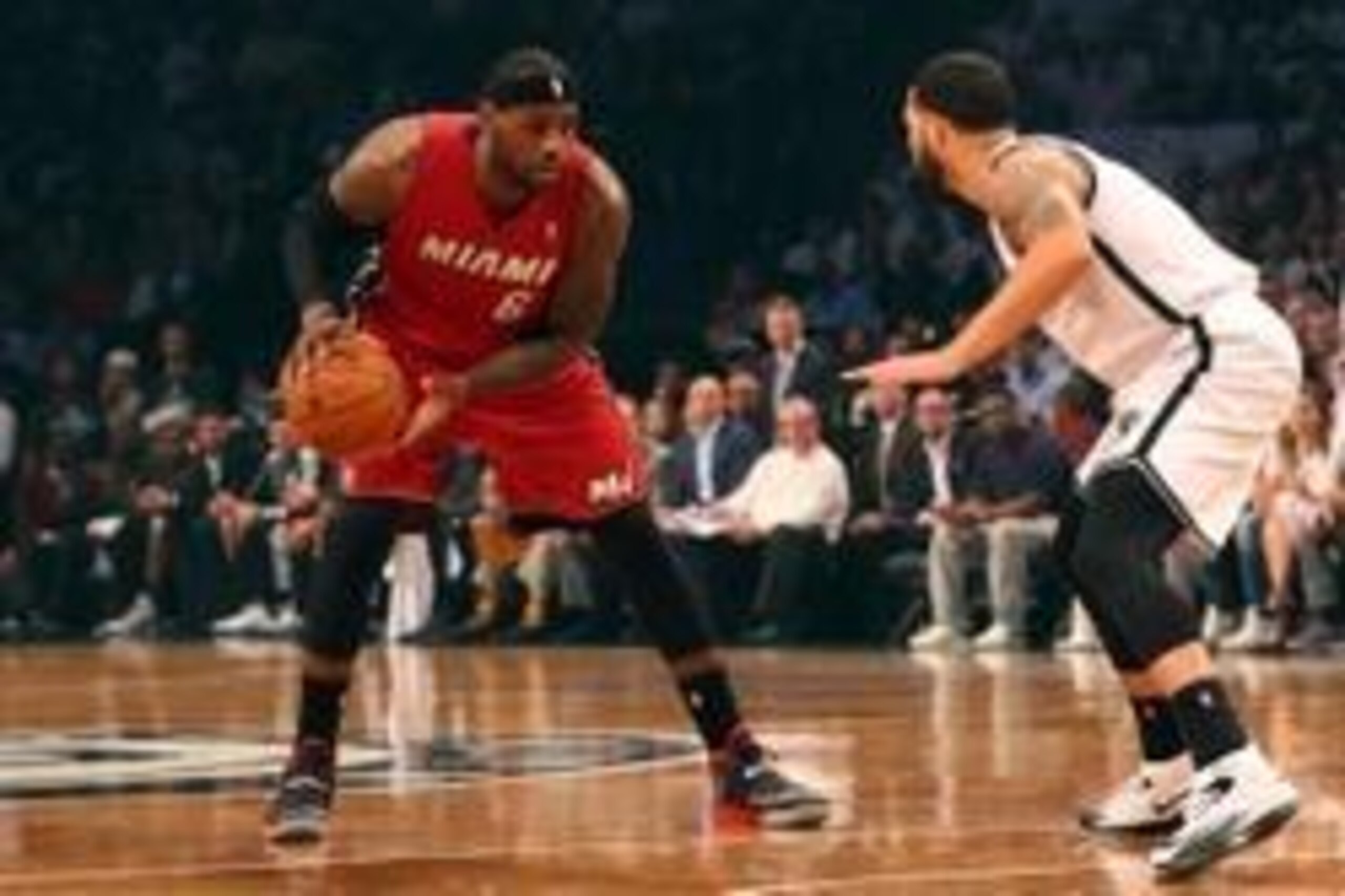 May 12, 2014; Brooklyn, NY, USA; Brooklyn Nets guard Deron Williams (8) defends Miami Heat forward LeBron James (6) during the first quarter in game four of the second round of the 2014 NBA Playoffs at Barclays Center. Mandatory Credit: Anthony Gruppuso-U