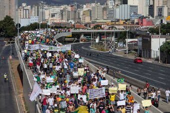 Protesters march toward the stadium where a Confederations Cup semifinal was taking place.