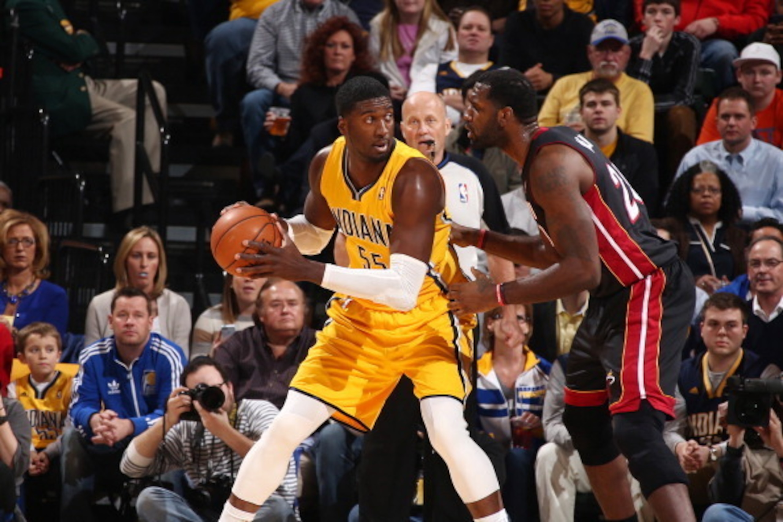 INDIANAPOLIS, IN - MARCH 26: Roy Hibbert #55 of the Indiana Pacers controls the ball against Greg Oden #20 of the Miami Heat during a game on March 26, 2014 at Bankers Life Fieldhouse in Indianapolis, IN.  NOTE TO USER: User expressly acknowledges and agr