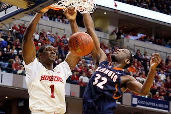 Mar 13, 2014; Indianapolis, IN, USA; Indiana Hoosiers forward Noah Vonleh (1) dunks against Illinois Fighting Illini forward Nnanna Egwu (32) in the first round of the Big Ten college basketball tournament at Bankers Life Fieldhouse. Mandatory Credit: Bri