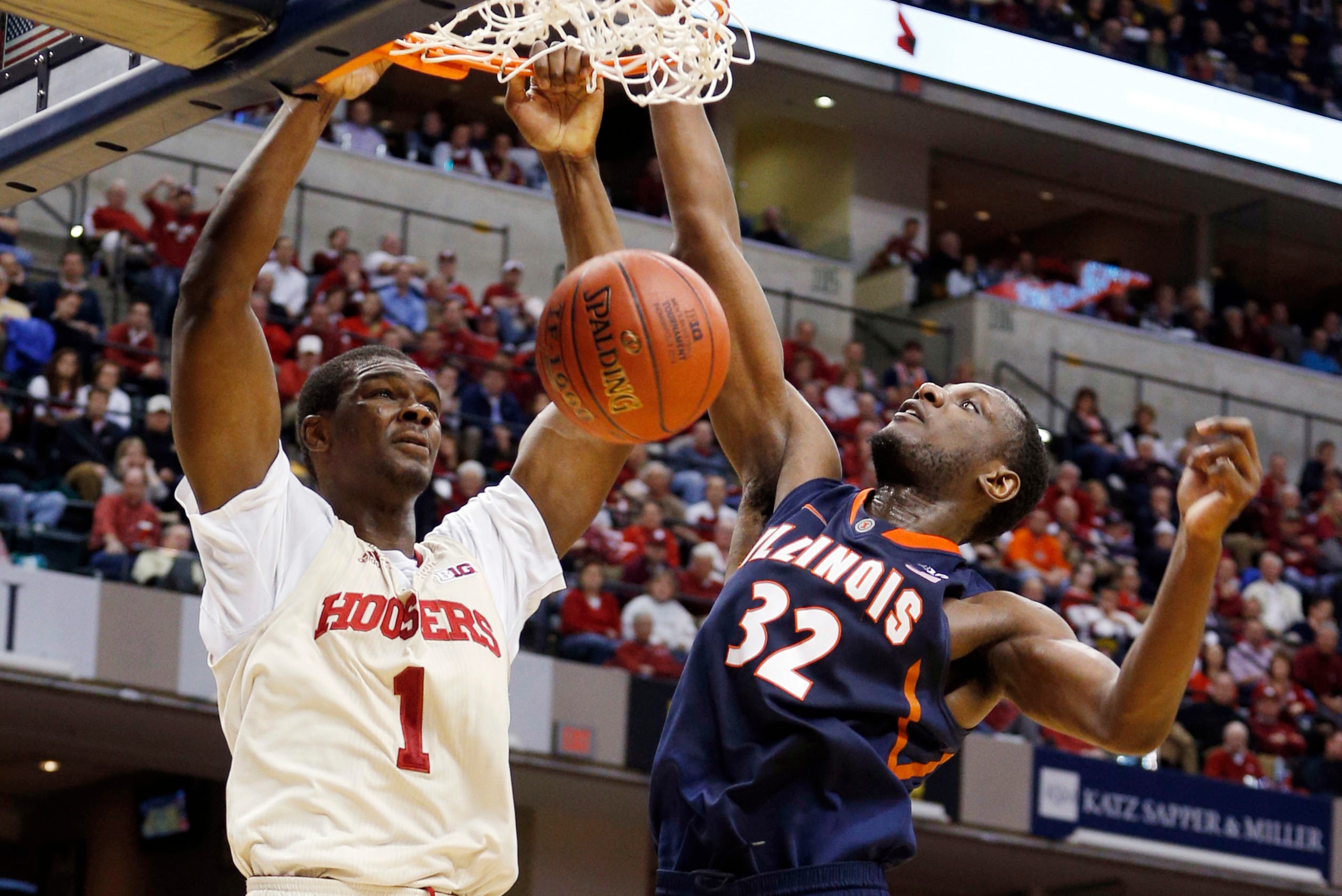 Mar 13, 2014; Indianapolis, IN, USA; Indiana Hoosiers forward Noah Vonleh (1) dunks against Illinois Fighting Illini forward Nnanna Egwu (32) in the first round of the Big Ten college basketball tournament at Bankers Life Fieldhouse. Mandatory Credit: Bri