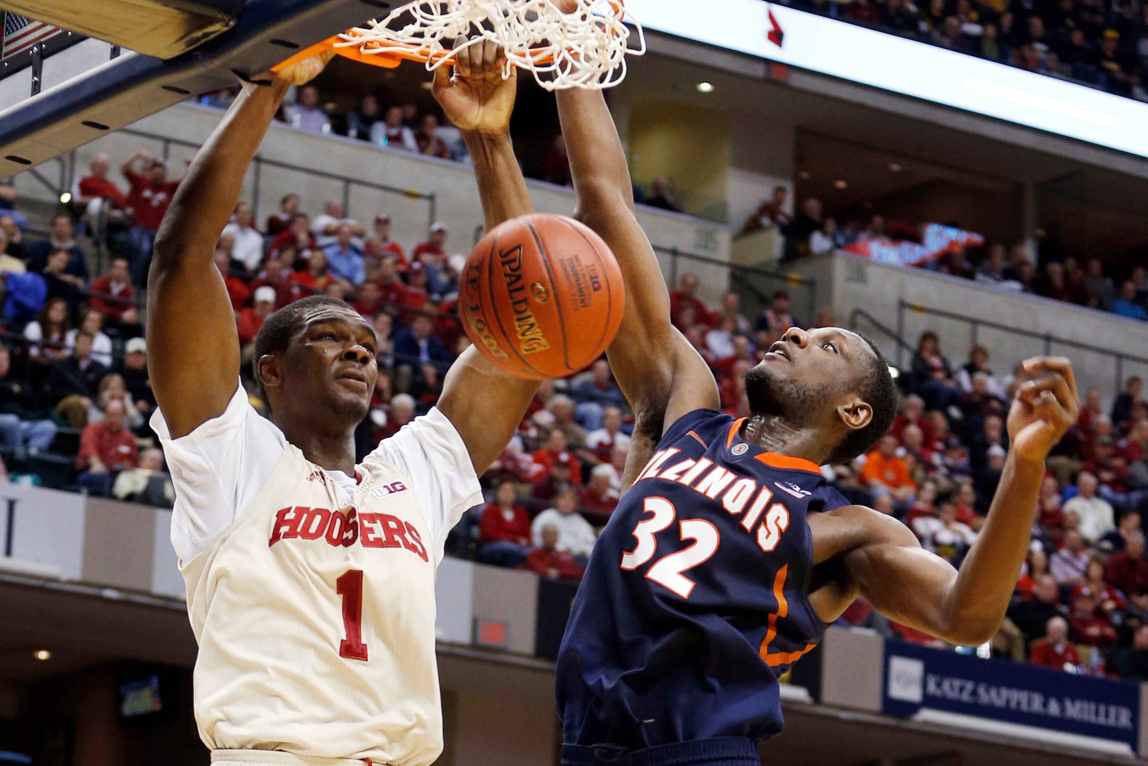 Mar 13, 2014; Indianapolis, IN, USA; Indiana Hoosiers forward Noah Vonleh (1) dunks against Illinois Fighting Illini forward Nnanna Egwu (32) in the first round of the Big Ten college basketball tournament at Bankers Life Fieldhouse. Mandatory Credit: Bri