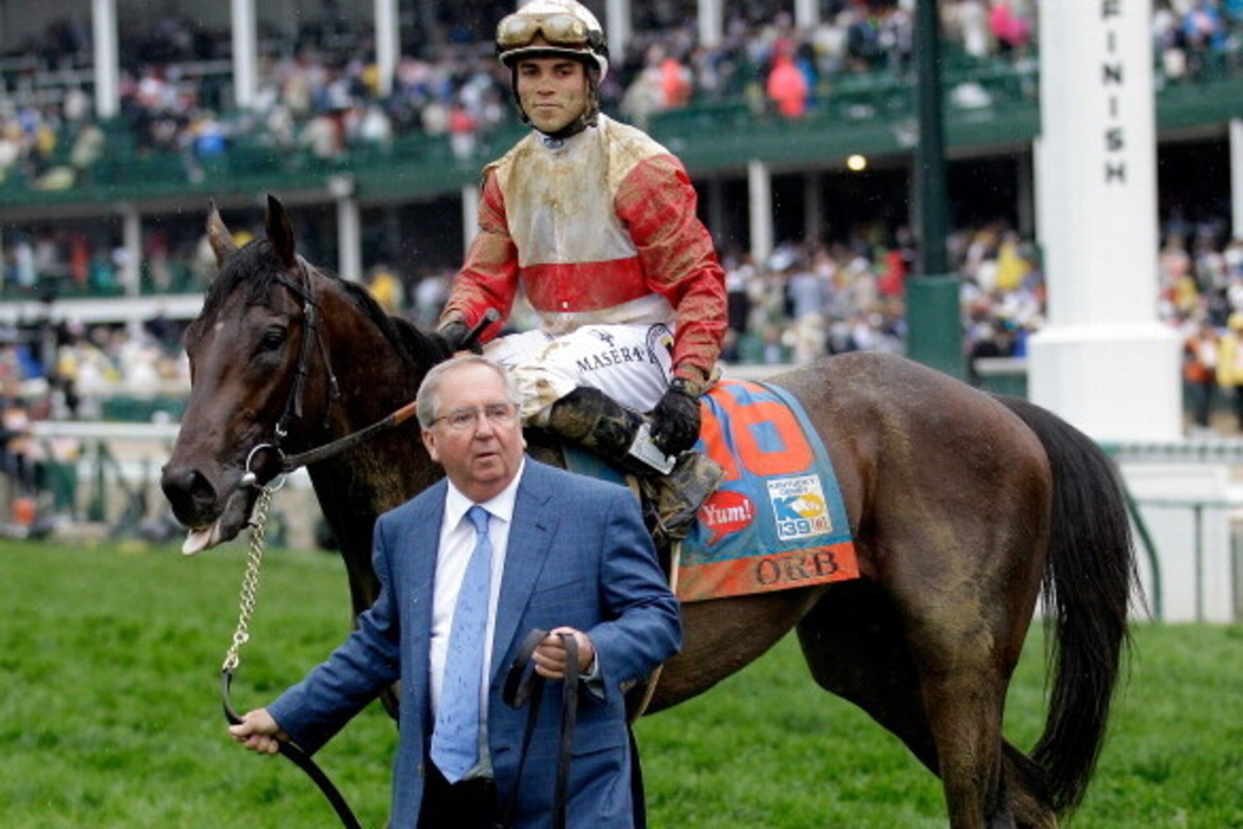 LOUISVILLE, KY - MAY 04:  Trainer Shug McGaughey (L) walks with Orb ridden by jockey Joel Rosario after winning the 139th running of the Kentucky Derby at Churchill Downs on May 4, 2013 in Louisville, Kentucky.  (Photo by Rob Carr/Getty Images)