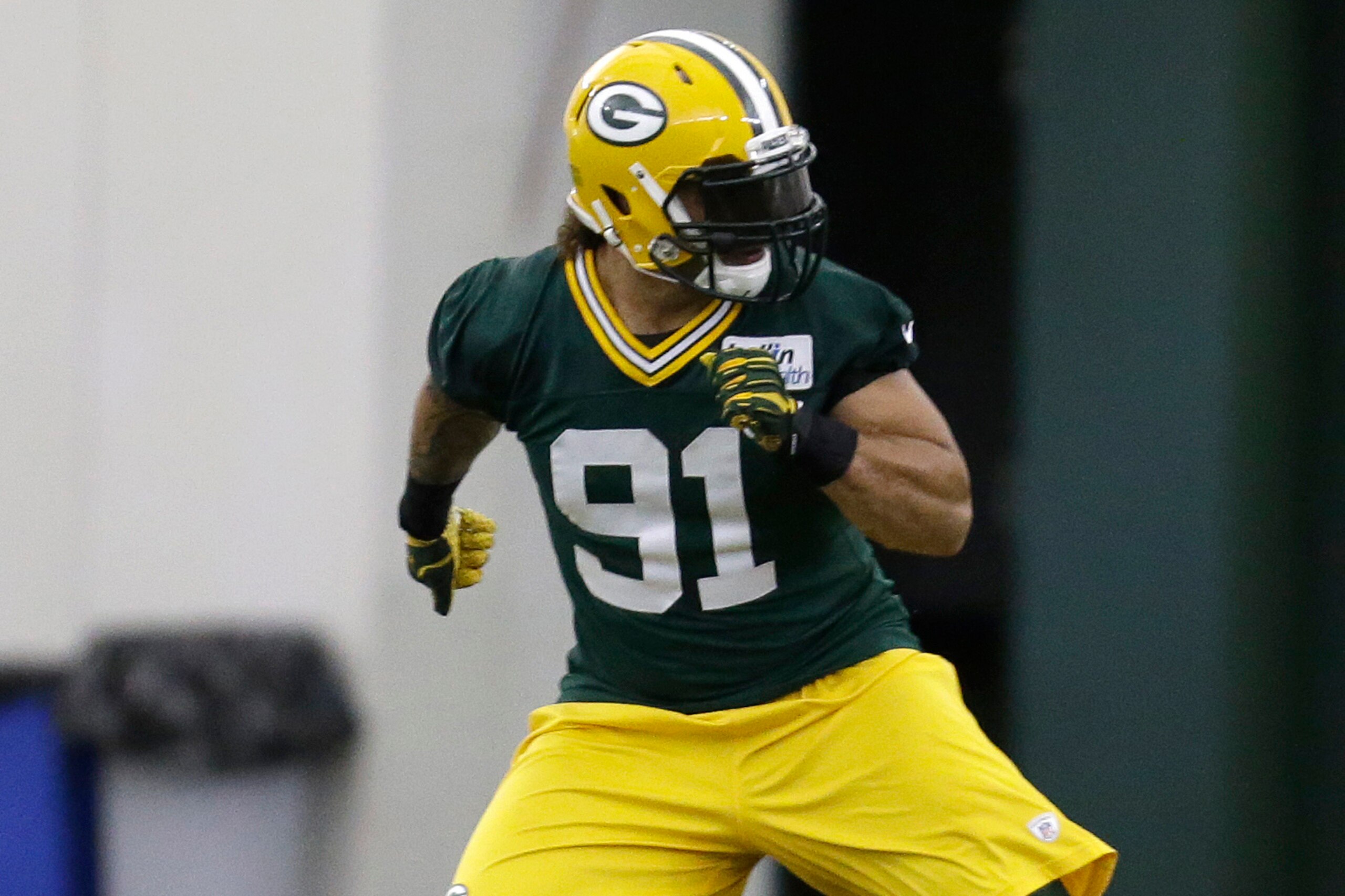 GREEN BAY, WI - MAY 16: Carl Bradford #91 of the Green Bay Packers runs through some drills during rookie minicamp at Don Hudson Center on May 16, 2014 in Green Bay, Wisconsin. (Photo by Mike McGinnis/Getty Images)
