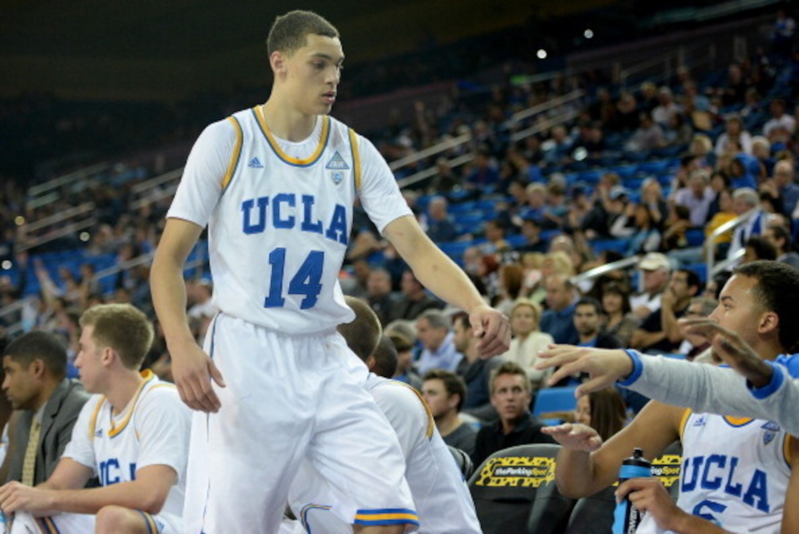 LOS ANGELES, CA - DECEMBER 14:  Zach LaVine #14 of the UCLA Bruins celebrates a lead over the Prairie View A&M Panthers with Kyle Anderson #5 as he leaves the game at Pauley Pavilion on December 14, 2013 in Los Angeles, California.  (Photo by Harry How/Ge