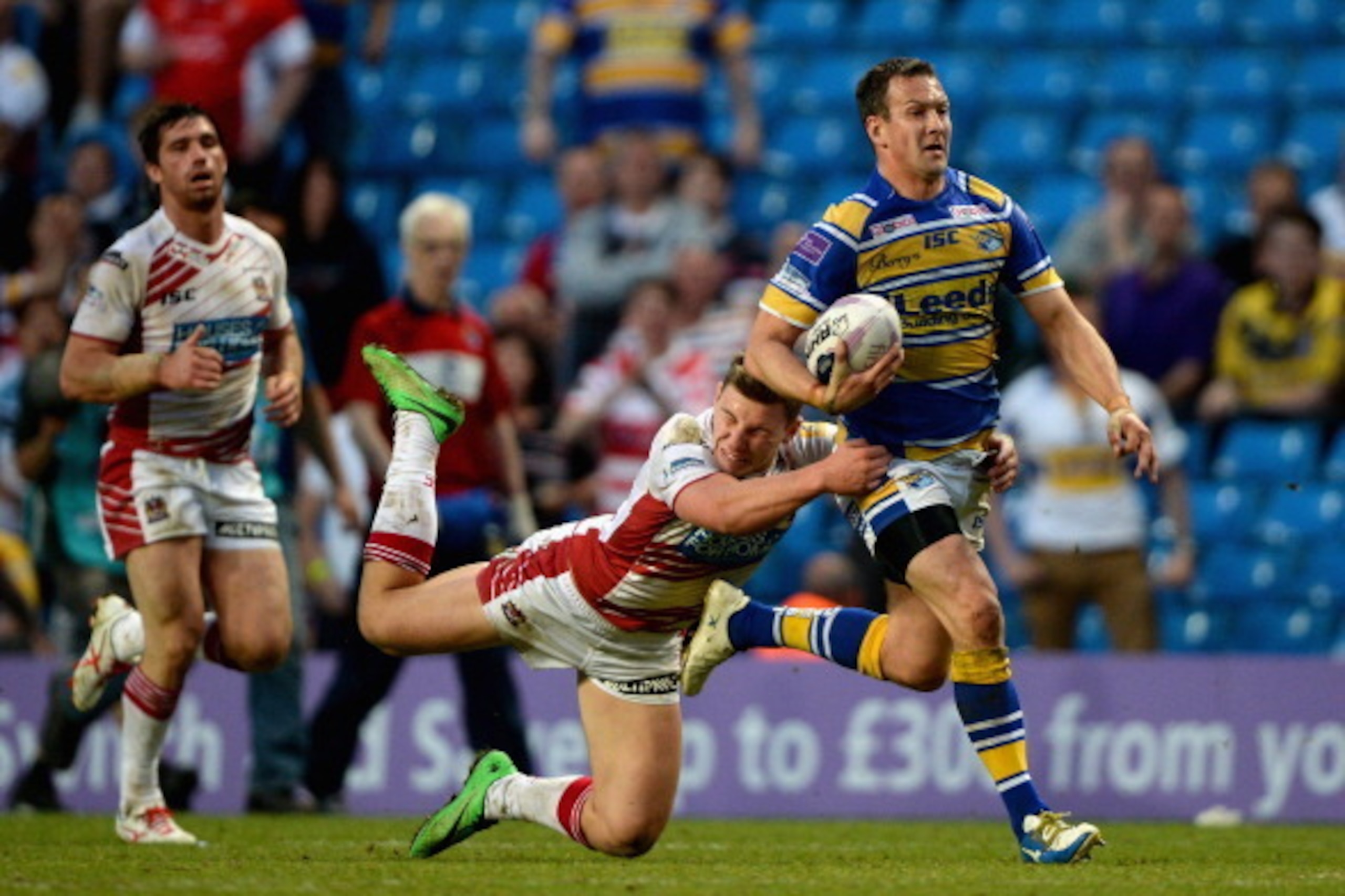 MANCHESTER, ENGLAND - MAY 17: Danny McGuire of Leeds Rhinos is tackled by George Williams of Wigan Warriors during the Super League match between Wigan Warriors and Leeds Rhinos at Etihad Stadium on May 17, 2014 in Manchester, England. (Photo by Gareth MANCHESTER, ENGLAND - MAY 17: Danny McGuire of Leeds Rhinos is tackled by George Williams of Wigan Warriors during the Super League match between Wigan Warriors and Leeds Rhinos at Etihad Stadium on May 17, 2014 in Manchester, England. (Photo by Gareth