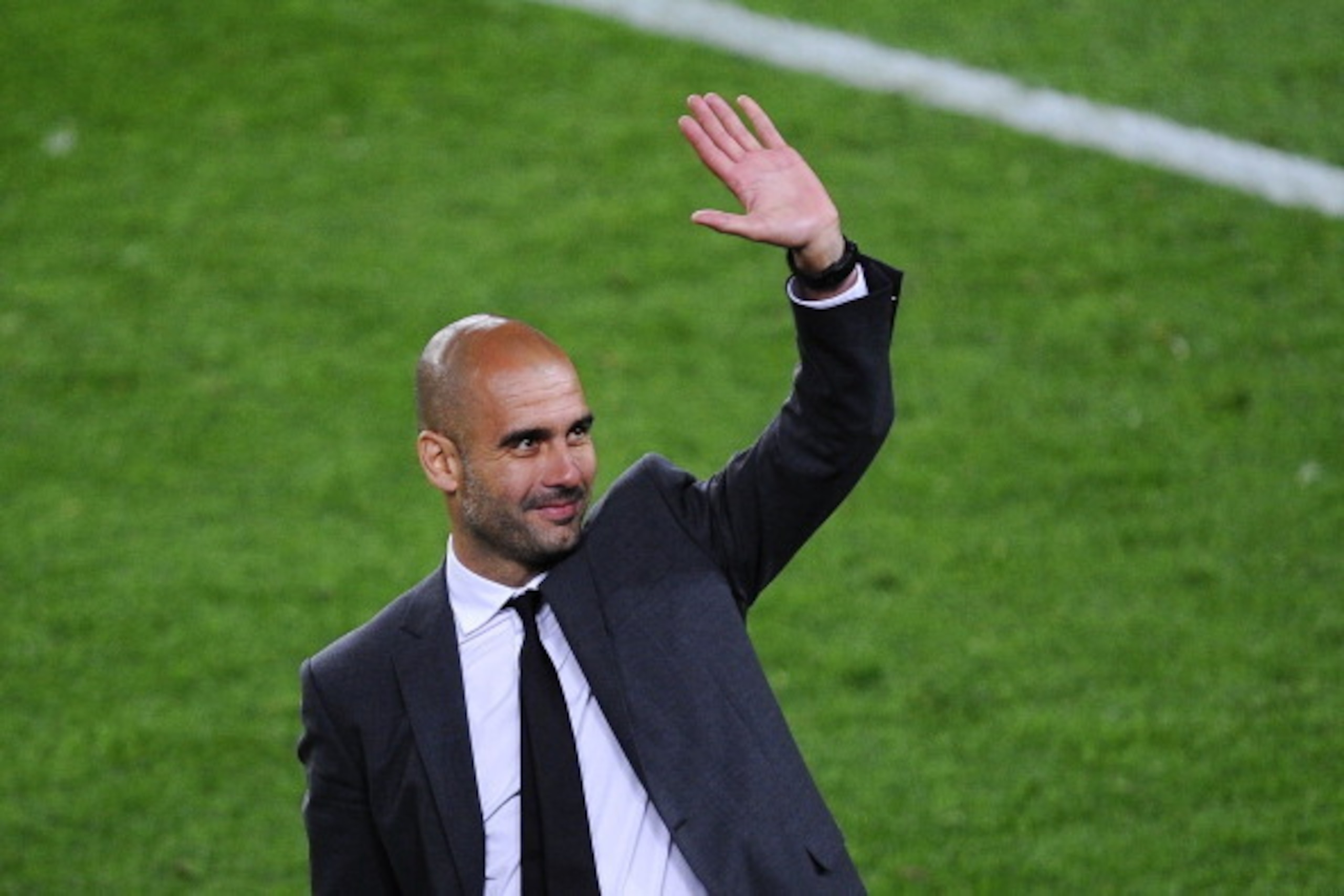 BARCELONA, SPAIN - MAY 05:  Head coach Josep Guardiola of FC Barcelona acknowledge the fans at the end of the La Liga match between FC Barcelona and RCD Espanyol at Camp Nou on May 5, 2012 in Barcelona, Spain. This is Guardiola's last match.  (Photo by Da