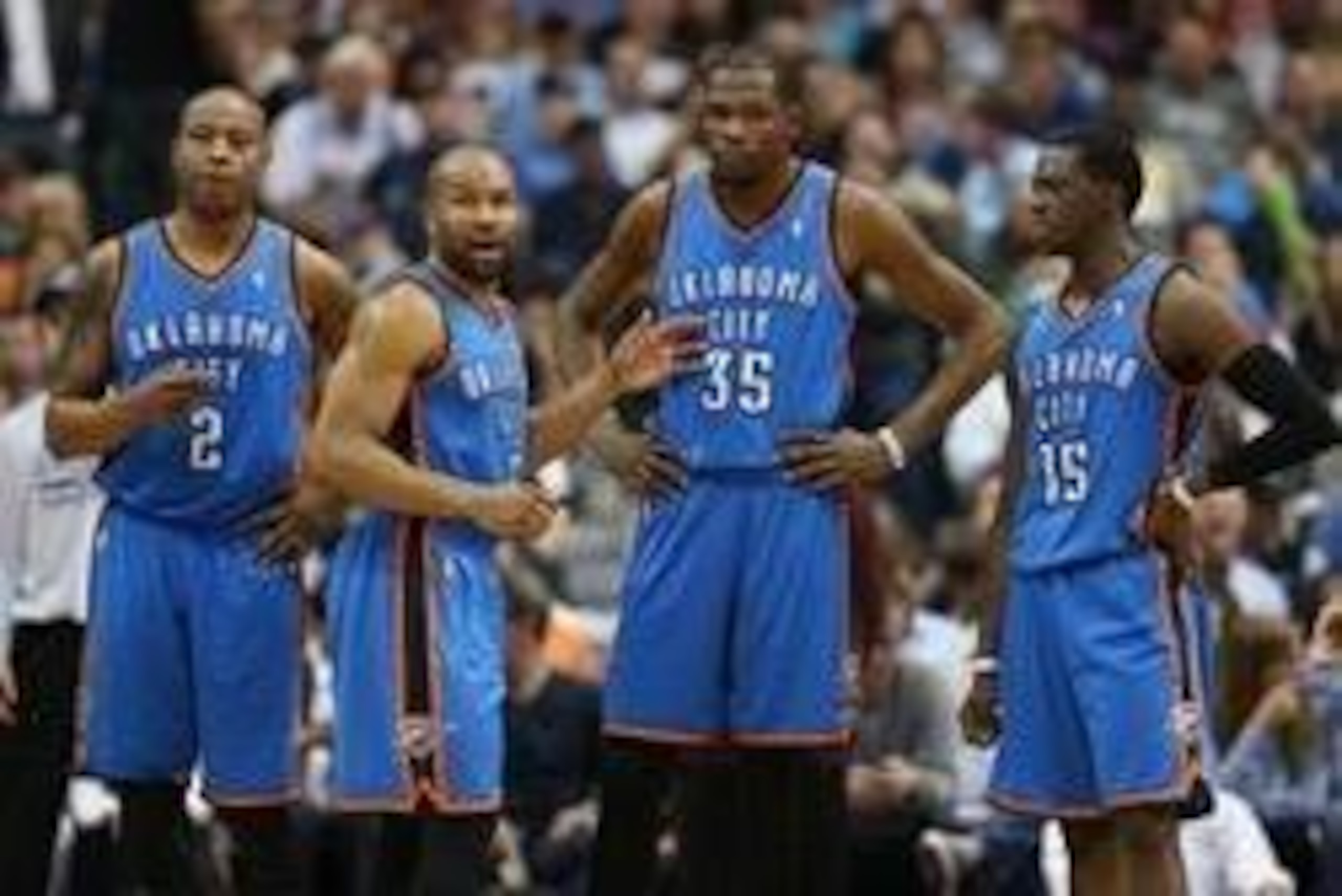 Mar 25, 2014; Dallas, TX, USA; Oklahoma City Thunder forward Caron Butler (2) guard Derek Fisher (6) forward Kevin Durant (35) and guard Reggie Jackson (15) look on in the second half against the Dallas Mavericks  at American Airlines Center. The Mavs bea