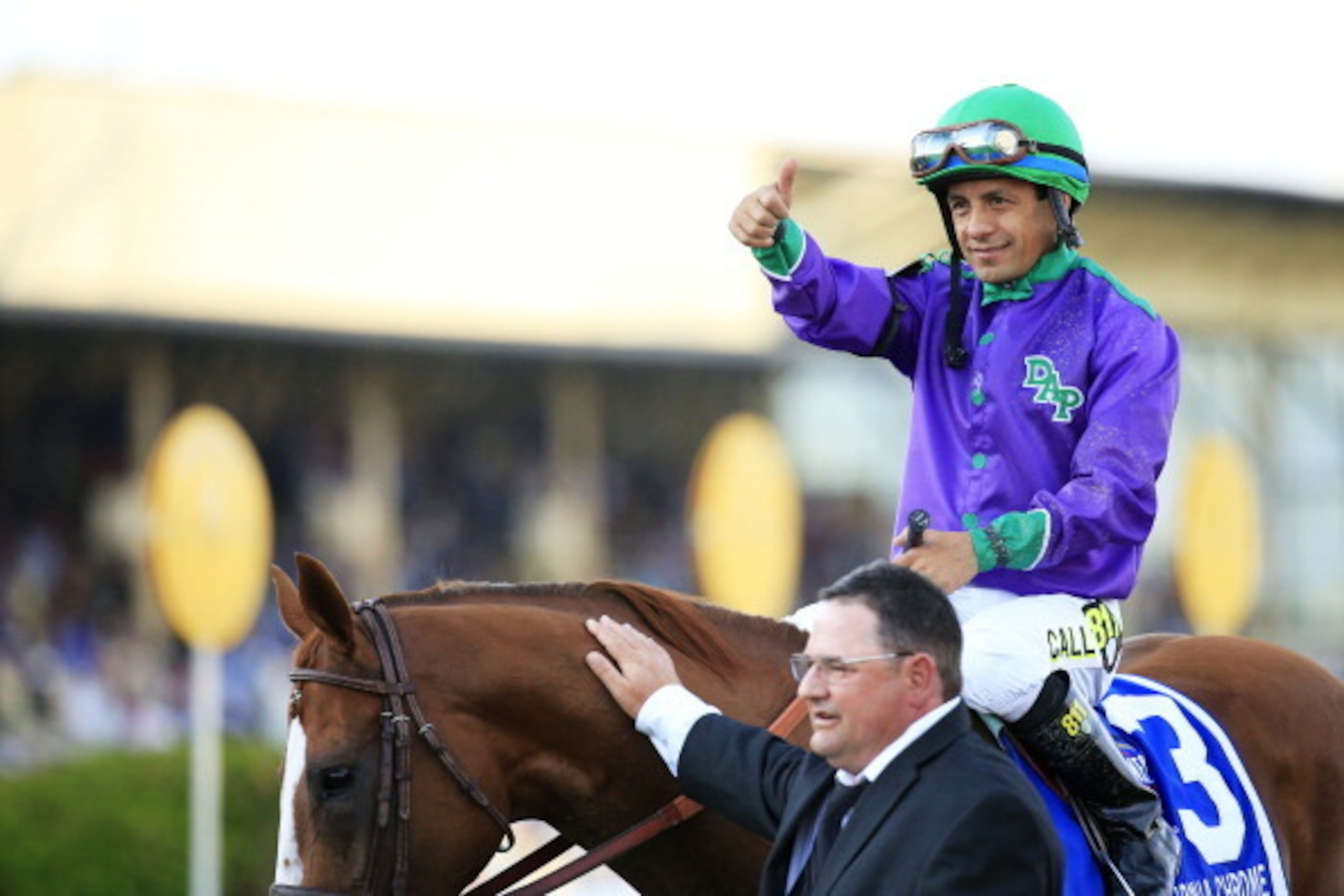 BALTIMORE, MD - MAY 17:  Victor Espinoza celebrates atop California Chrome #3 with assistant trainer Alan Sherman after winning the 139th running of the Preakness Stakes at Pimlico Race Course on May 17, 2014 in Baltimore, Maryland.  (Photo by Patrick Smi