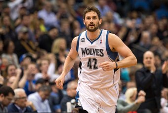 Mar 28, 2014; Minneapolis, MN, USA; Minnesota Timberwolves forward Kevin Love (42) runs on the court in the first half against the Los Angeles Lakers at Target Center. Mandatory Credit: Jesse Johnson-USA TODAY Sports