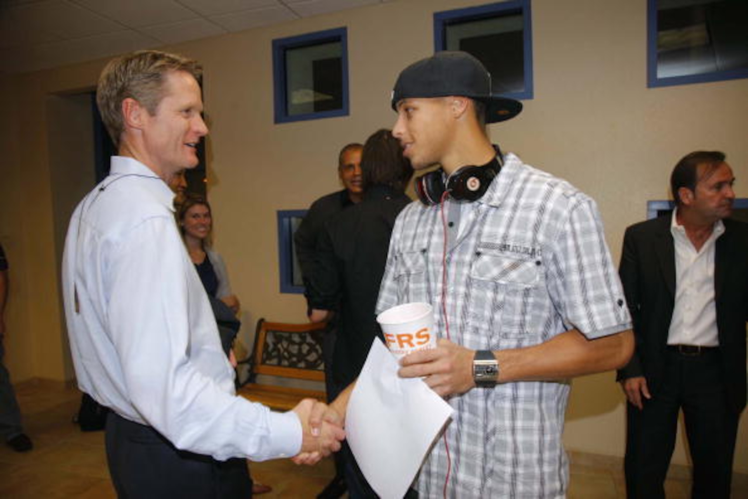 INDIAN WELLS, CA - OCTOBER 10: Stephen Curry #30 of the Golden State Warriors talks with Steve Kerr with the Phoenix Suns before the Warriors take on the Suns for an NBA preseason game on October 10, 2009 at Indian Wells Tennis Garden in Indian Wells, Cal