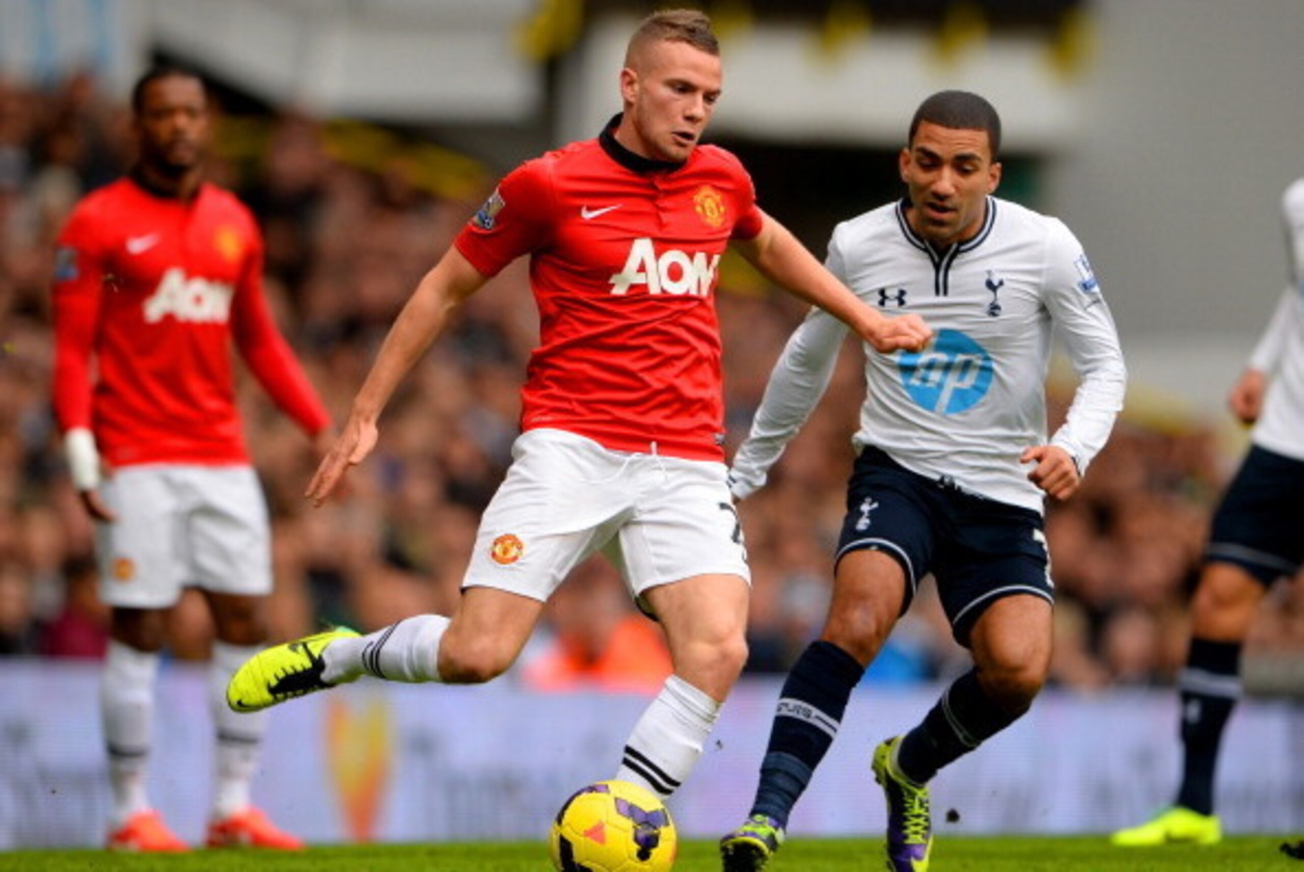LONDON, ENGLAND - DECEMBER 01: Aaron Lennon of Tottenham Hotspur marshalls Tom Cleverley of Manchester United  during the Barclays Premier League Match between Tottenham Hotspur and Manchester United at White Hart Lane on December 1, 2013 in London, Engla