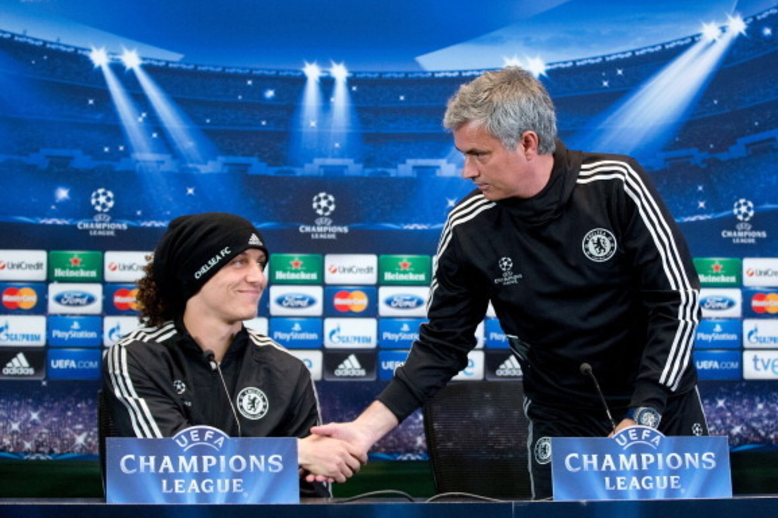 MADRID, SPAIN - APRIL 21:  Head coach Jose Mourinho (R) of Chelsea FC shakes hands with player David Luiz (L) after his press conference the day before the UEFA Champions League Semifinal first leg match between Club Atletico de Madrid and Chelsea FC at V