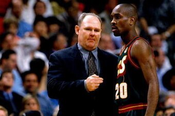 CHICAGO - JUNE 5:  Gary Payton #20 of the Seattle SuperSonics discusses strategy with head coach George Karl in Game One of the NBA Finals against the Chicago Bulls at the United Center on June 5, 1996 in Chicago, Illinois.  The Bulls won 107-90.  NOTE TO