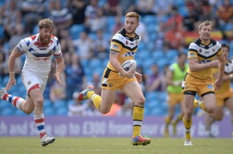 MANCHESTER, ENGLAND - MAY 18:  Marc Sneyd of Castleford Tigers breaks free to score a second helf try during the Super League match between Wakefield Wildcats and Castleford Tigers at Etihad Stadium on May 18, 2014 in Manchester, England.  (Photo by Garet