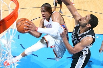 OKLAHOMA CITY, OK - APRIL 03: Russell Westbrook #0 of the Oklahoma City Thunder shoots against the San Antonio Spurs  on April 03, 2014 at the Chesapeake Energy Arena in Oklahoma City, Oklahoma. NOTE TO USER: User expressly acknowledges and agrees that, b