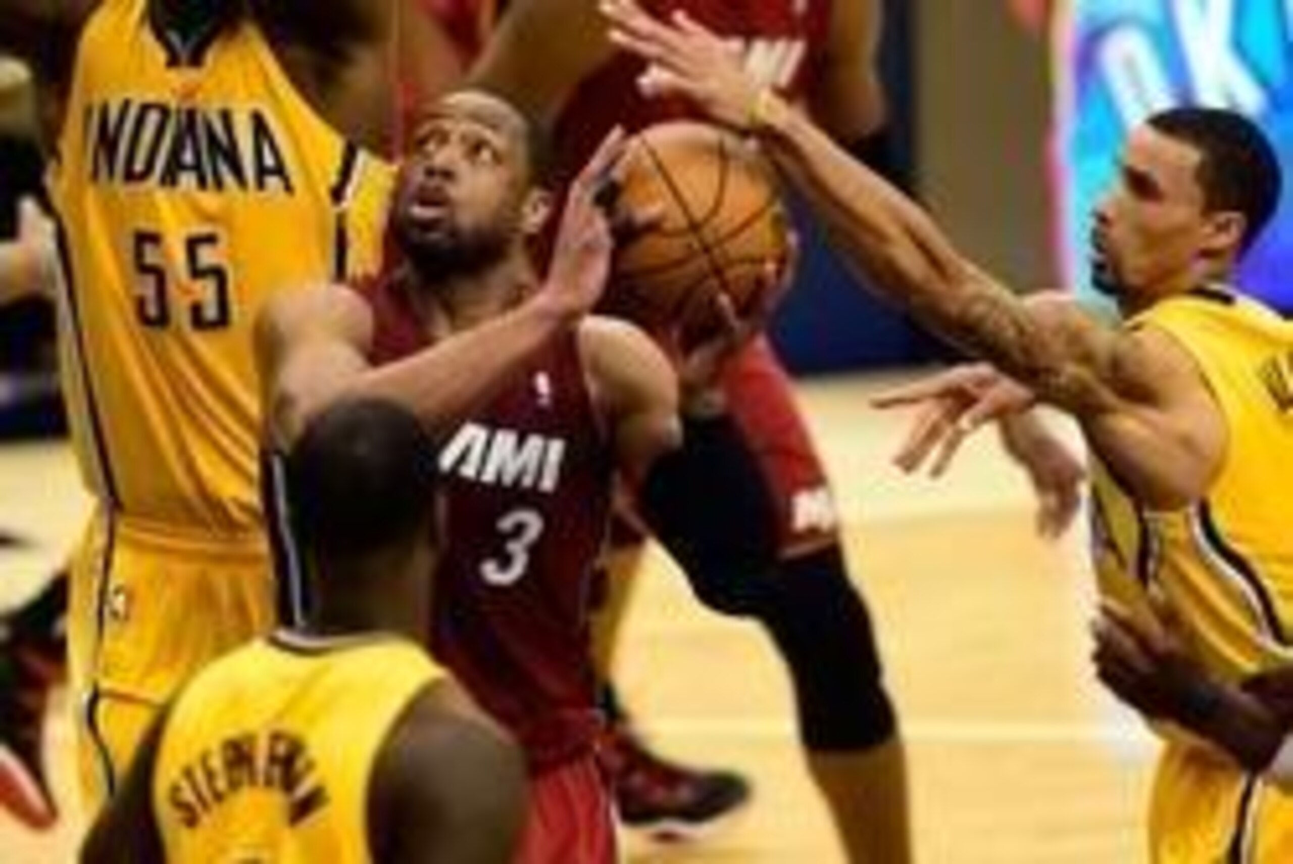 May 18, 2014; Indianapolis, IN, USA; Miami Heat guard Dwyane Wade (3) has the ball knocked loose by Indiana Pacers guard George Hill (3) on a drive to the basket during the second half of game one of the Eastern Conference Finals of the 2014 NBA Playoffs
