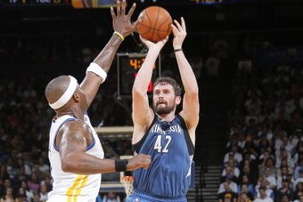 OAKLAND, CA - APRIL 14: Kevin Love #42 of the Minnesota Timberwolves shoots against the Golden State Warriors on April 14, 2014 at Oracle Arena in Oakland, California. NOTE TO USER: User expressly acknowledges and agrees that, by downloading and or using 