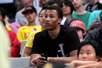 MELBOURNE, AUSTRALIA - FEBRUARY 16:  2014 NBA draft prospect Dante Exum watches the round 18 NBL match between the Melbourne Tigers and the Adelaide 36ers at Hisense Arena in February 16, 2014 in Melbourne, Australia.  (Photo by Graham Denholm/Getty Image