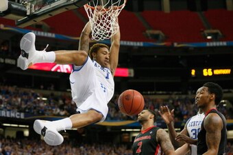 ATLANTA, GA - MARCH 15:  James Young #1 of the Kentucky Wildcats dunks the ball against the Georgia Bulldogs during the semifinals of the SEC Men's Basketball Tournament at Georgia Dome on March 15, 2014 in Atlanta, Georgia.  (Photo by Kevin C. Cox/Getty 