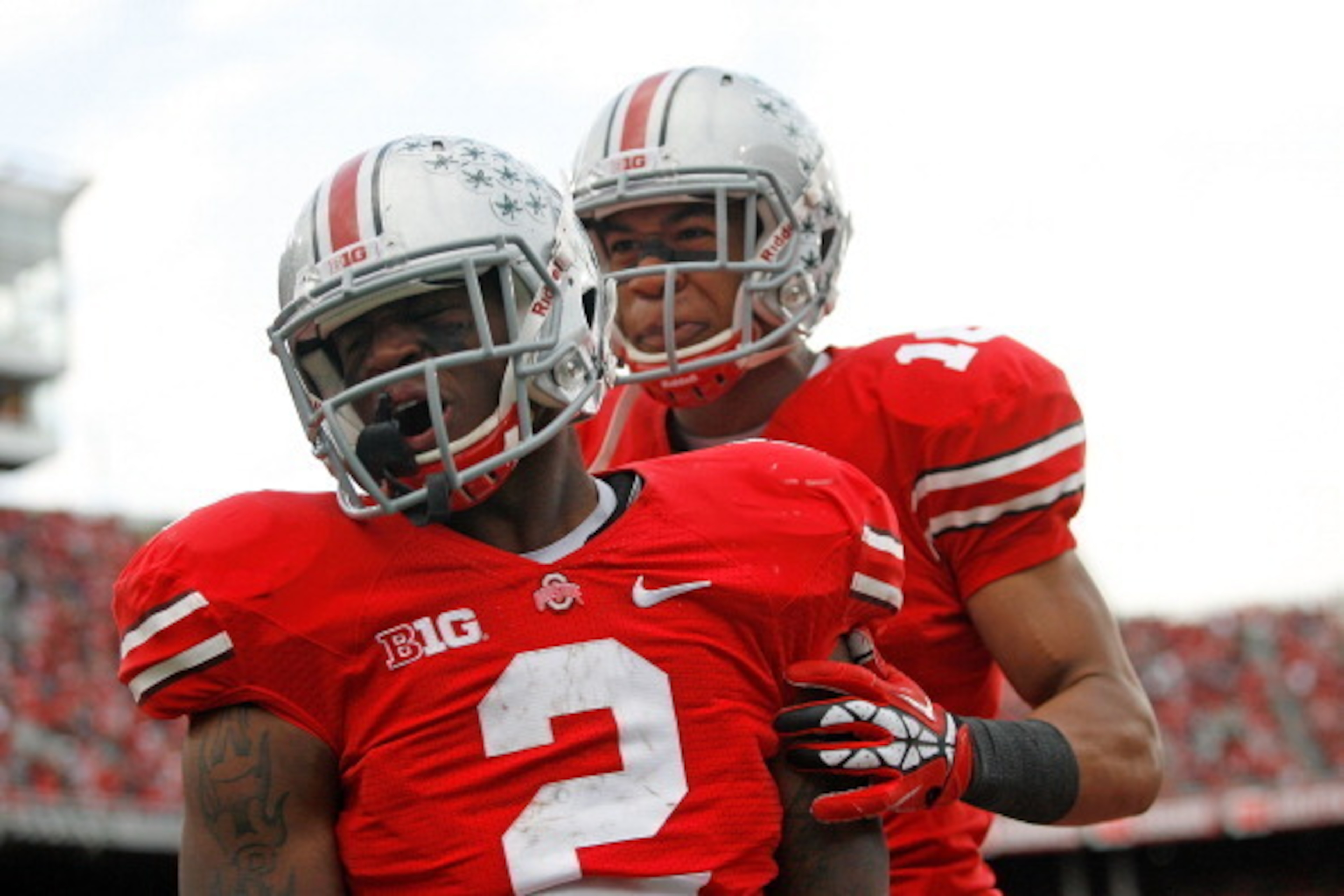 COLUMBUS, OH - NOVEMBER 03:  Rod Smith #2 is congratulated Evan Spencer #16, both of the Ohio State Buckeyes, after scoring a touchdown against the Illinois Illini during the second quarter on November 3, 2012 at Ohio Stadium in Columbus, Ohio. (Photo by 