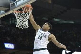 Mar 22, 2014; Spokane, WA, USA; Michigan State Spartans guard Gary Harris (14) dunks against the Harvard Crimson in the first half of a men's college basketball game during the third round of the 2014 NCAA Tournament at Veterans Memorial Arena. Mandatory 