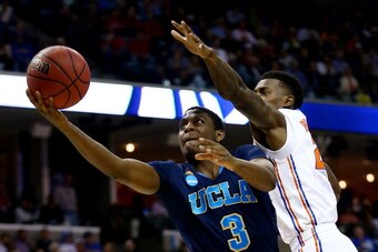 MEMPHIS, TN - MARCH 27:  Jordan Adams #3 of the UCLA Bruins goes to the basket as Casey Prather #24 of the Florida Gators defends during a regional semifinal of the 2014 NCAA Men's Basketball Tournament at the FedExForum on March 27, 2014 in Memphis, Tenn