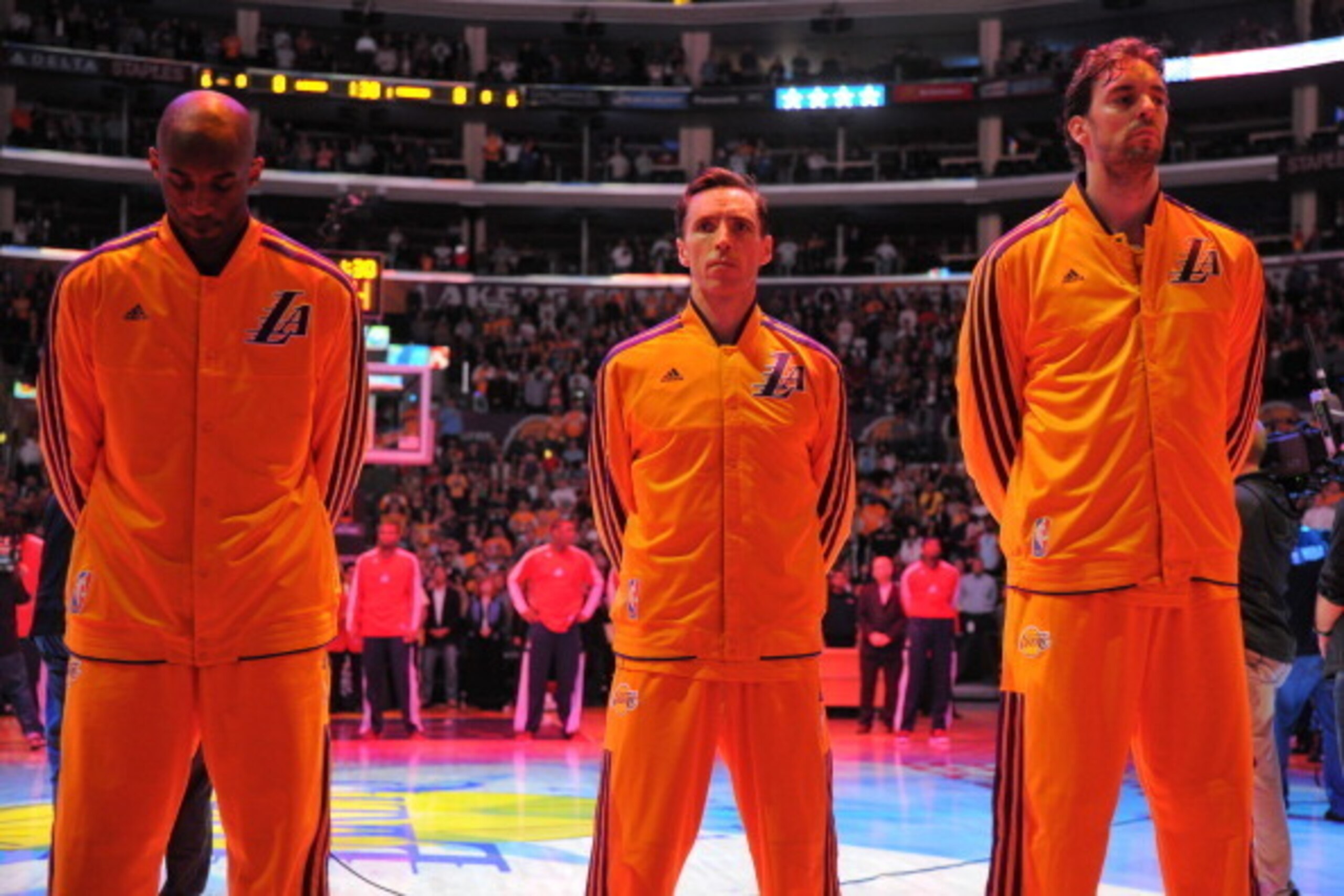 LOS ANGELES, CA - MARCH 22: Kobe Bryant #24, Steve Nash #10, and Pau Gasol #16 of the Los Angeles Lakers look on during the performance of the National Anthem before playing the Washington Wizards at Staples Center on March 22, 2013 in Los Angeles, Califo