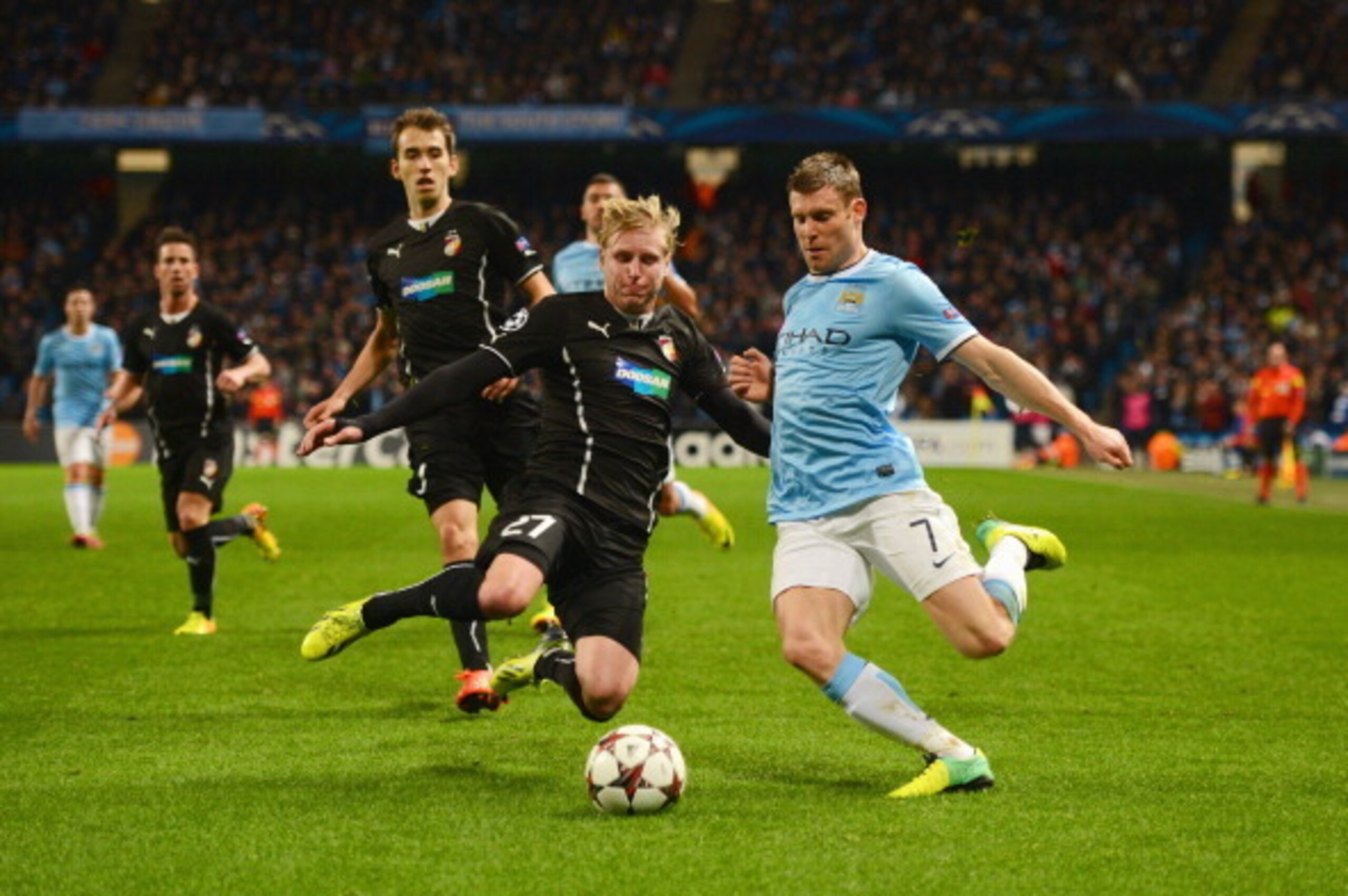 MANCHESTER, ENGLAND - NOVEMBER 27: James Milner of Manchester City is closed down by Frantisek Rajtoral of Plzen during the UEFA Champions League Group D match between Manchester City and FC Viktoria Plzen at Etihad Stadium on November 27, 2013 in Manches