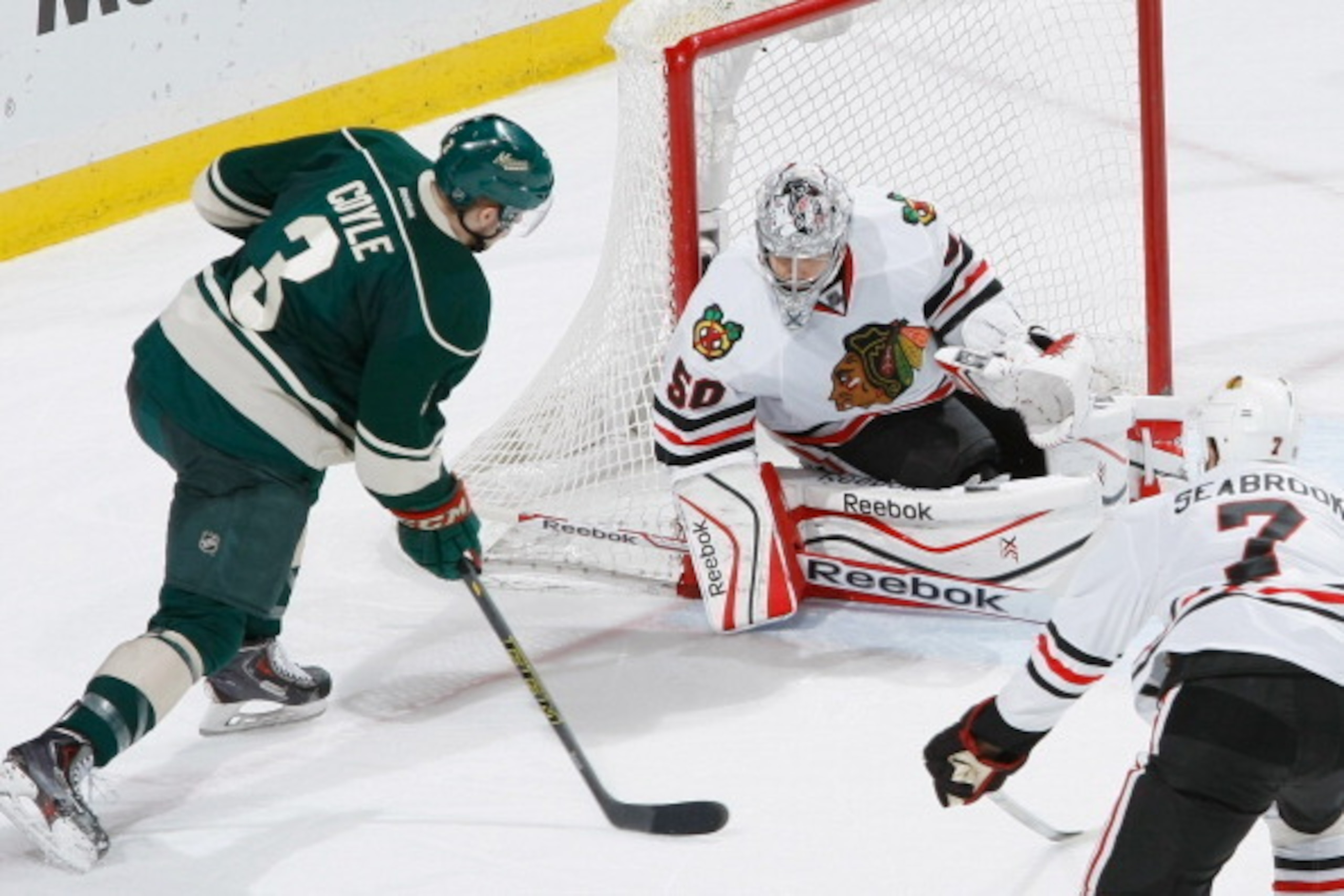 ST. PAUL, MN - MAY 13: Corey Crawford #50 of the Chicago Blackhawks makes a save against Charlie Coyle #3 of the Minnesota Wild during Game Six of the Second Round of the 2014 Stanley Cup Playoffs on May 13, 2014 at the Xcel Energy Center in St. Paul, Min