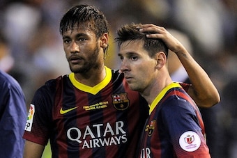 VALENCIA, SPAIN - APRIL 16:  Lionel Messi (R) and Neymar of FC Barcelona react after losing 2-1 to Real Madrid in the Copa del Rey Final between Real Madrid and Barcelona at Estadio Mestalla on April 16, 2014 in Valencia, Spain.  (Photo by Denis Doyle/Get
