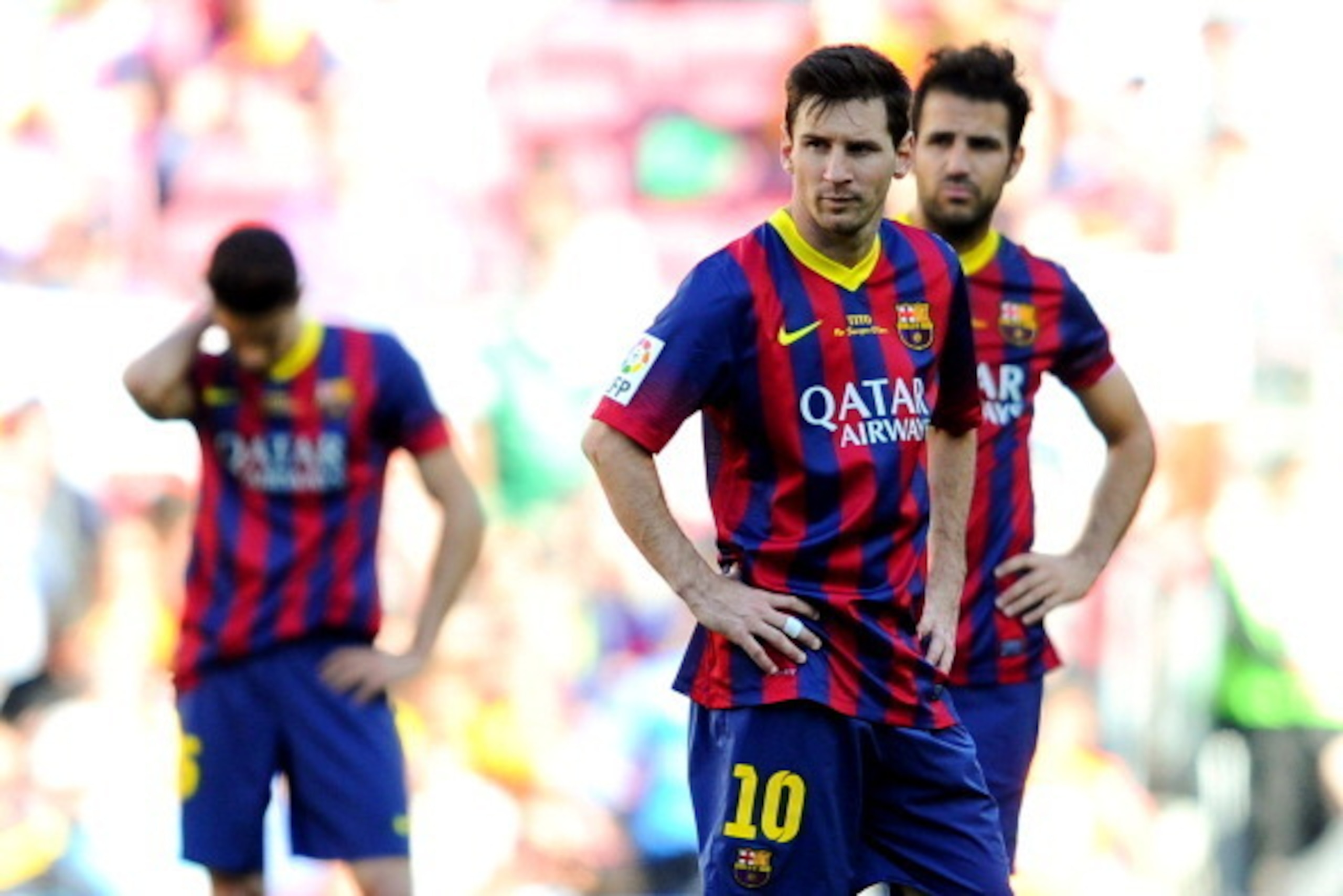 BARCELONA, SPAIN - MAY 03:  Lionel Messi (C) of FC Barcelona shows his dejection after Angel Latifa of Getafe CF scored his team's second goal during La Liga match between FC Barcelona and Getafe CF at Nou Camp on May 3, 2014 in Barcelona, Spain.  (Photo 
