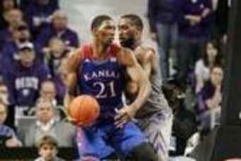 Feb 10, 2014; Manhattan, KS, USA; Kansas Jayhawks center Joel Embiid (21) dribbles against Kansas State Wildcats forward Thomas Gipson (42) during the Jayhawks' 85-82 overtime loss at Fred Bramlage Coliseum. Mandatory Credit: Scott Sewell-USA TODAY Sports