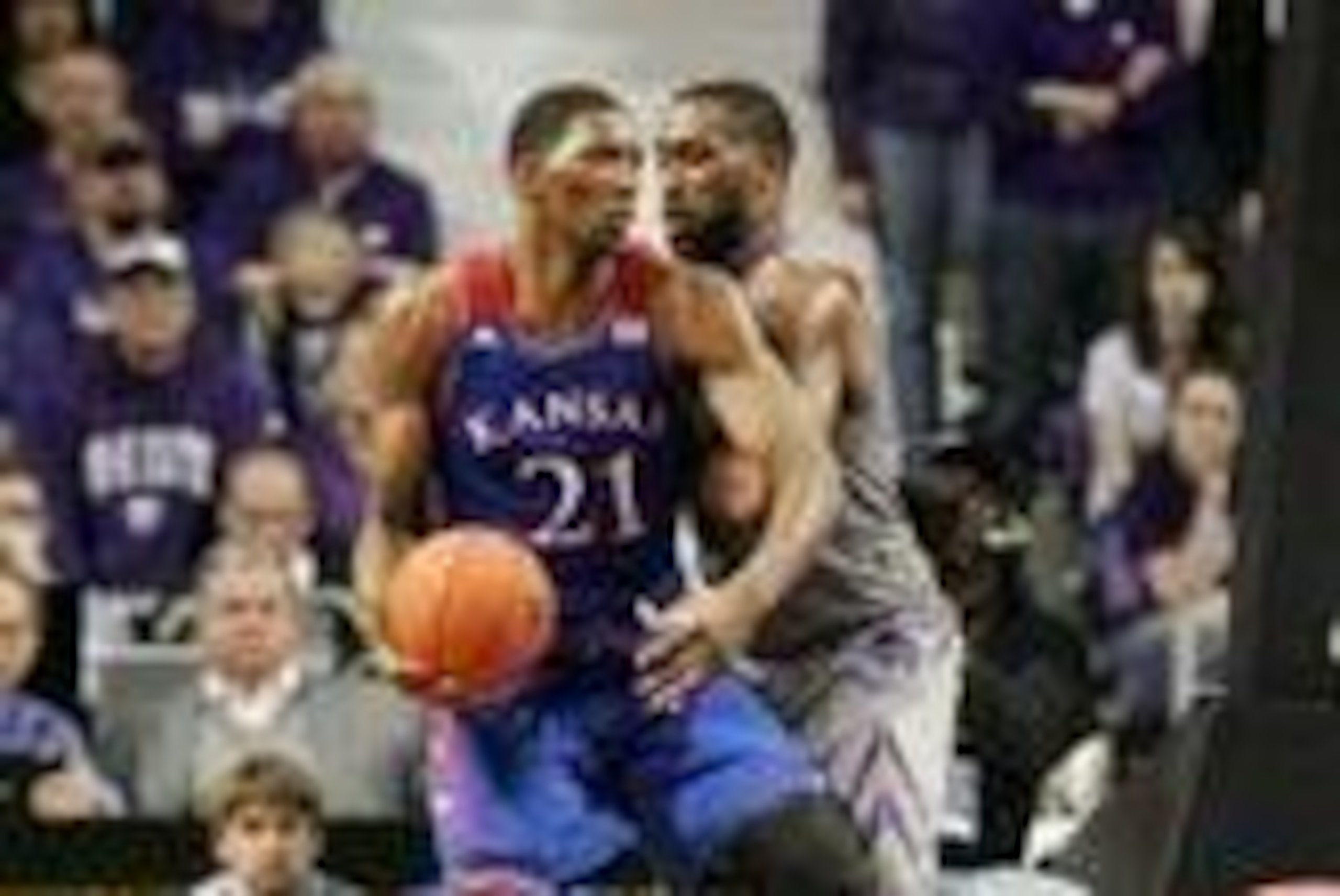 Feb 10, 2014; Manhattan, KS, USA; Kansas Jayhawks center Joel Embiid (21) dribbles against Kansas State Wildcats forward Thomas Gipson (42) during the Jayhawks' 85-82 overtime loss at Fred Bramlage Coliseum. Mandatory Credit: Scott Sewell-USA TODAY Sports