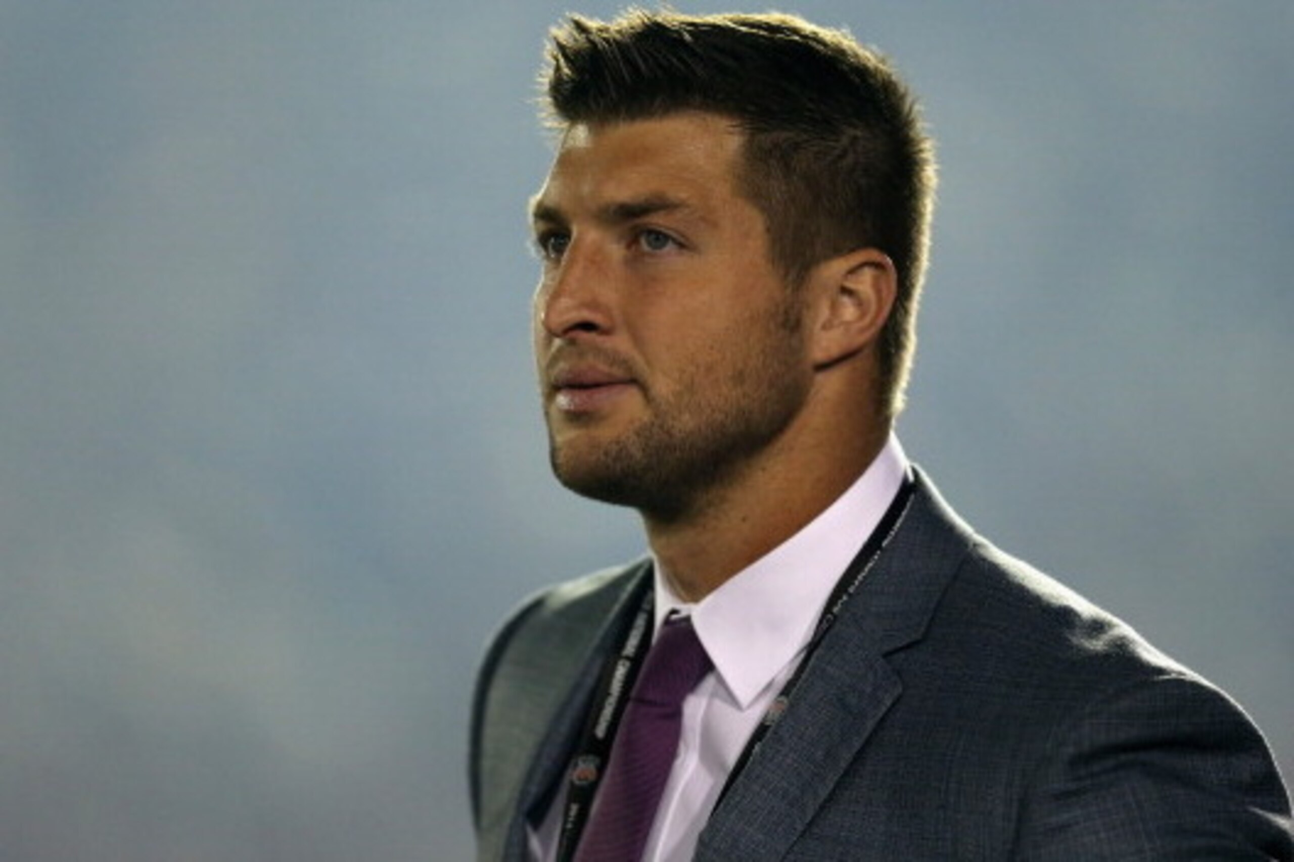 PASADENA, CA - JANUARY 06:  ESPN analyst Tim Tebow looks on during the 2014 Vizio BCS National Championship Game between the Florida State Seminoles and the Auburn Tigers at the Rose Bowl on January 6, 2014 in Pasadena, California.  (Photo by Jeff Gross/G