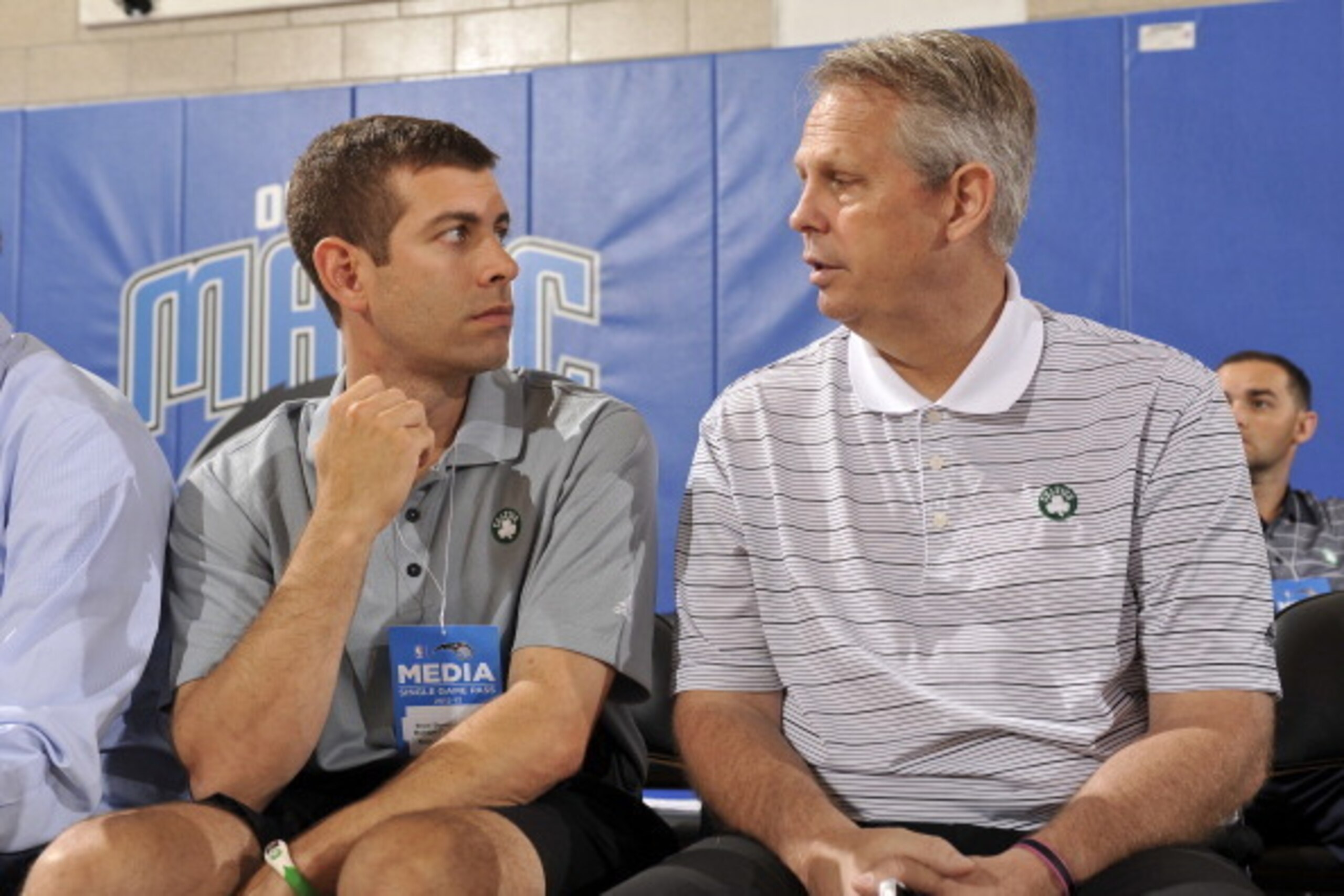ORLANDO, FL - JULY 7:  New Coach of the Boston Celtics Brad Stevens (L) confers with Daniel Ray 'Danny' Ainge, basketball executive, President of Basketball Operations for the Boston Celtics, during the 2013 Southwest Airlines Orlando Pro Summer League ga